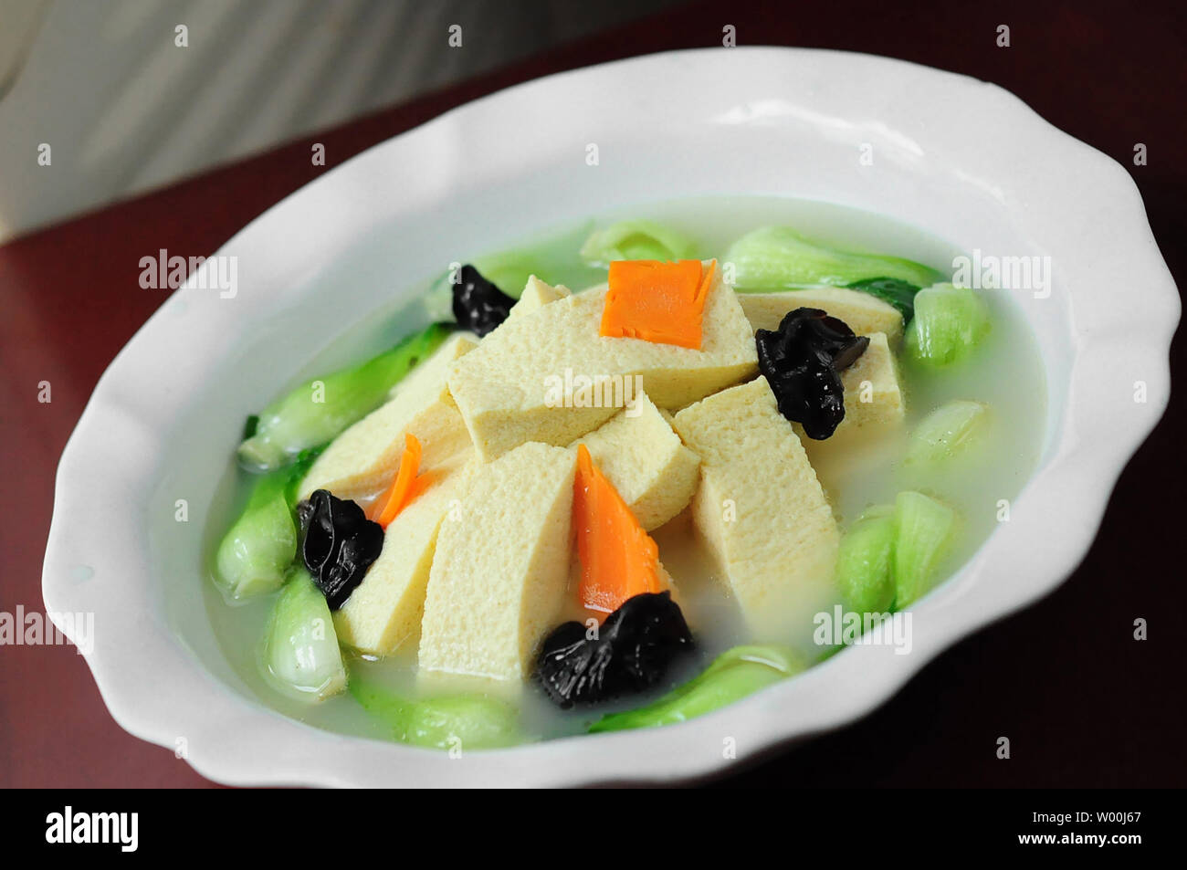 Cake Chowder Fish cake chowder fungus soup Stock Photo - Alamy