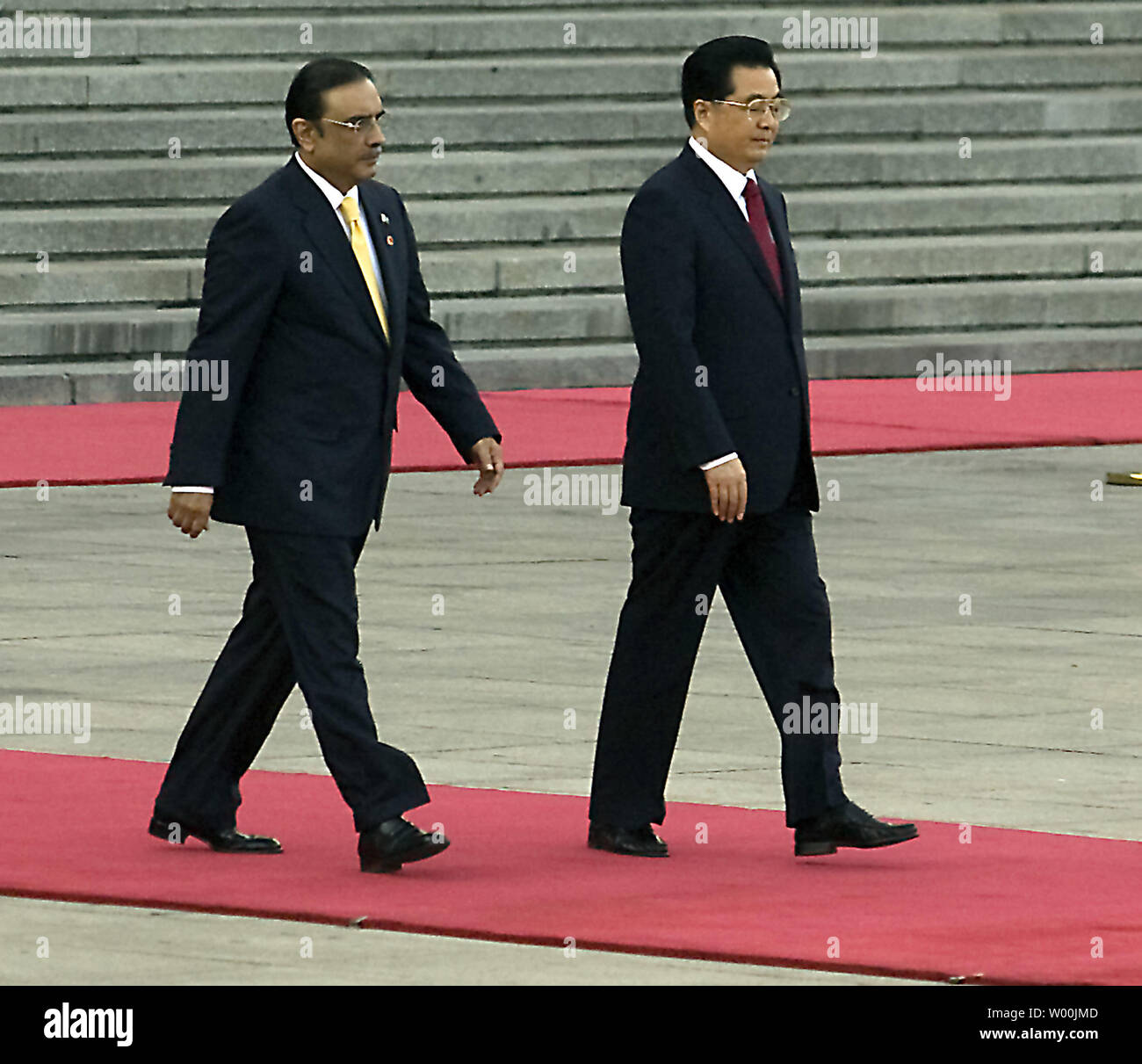Chinese President Hu Jintao (R) and his Pakistani counterpart Asif Ali Zardari attend an official welcoming ceremony at the Great Hall of the People in Beijing October 15, 2008. Zardari arrived on Tuesday for his first visit to China as president, and has said he wants his four-day trip 'to remind the leadership of the world how close our relationship is'. Pakistan is set to usher in a series of agreements with China during the trip, highlighting Islamabad's hopes that Beijing will help it through economic and diplomatic troubles. (UPI Photo/Stephen Shaver) Stock Photo