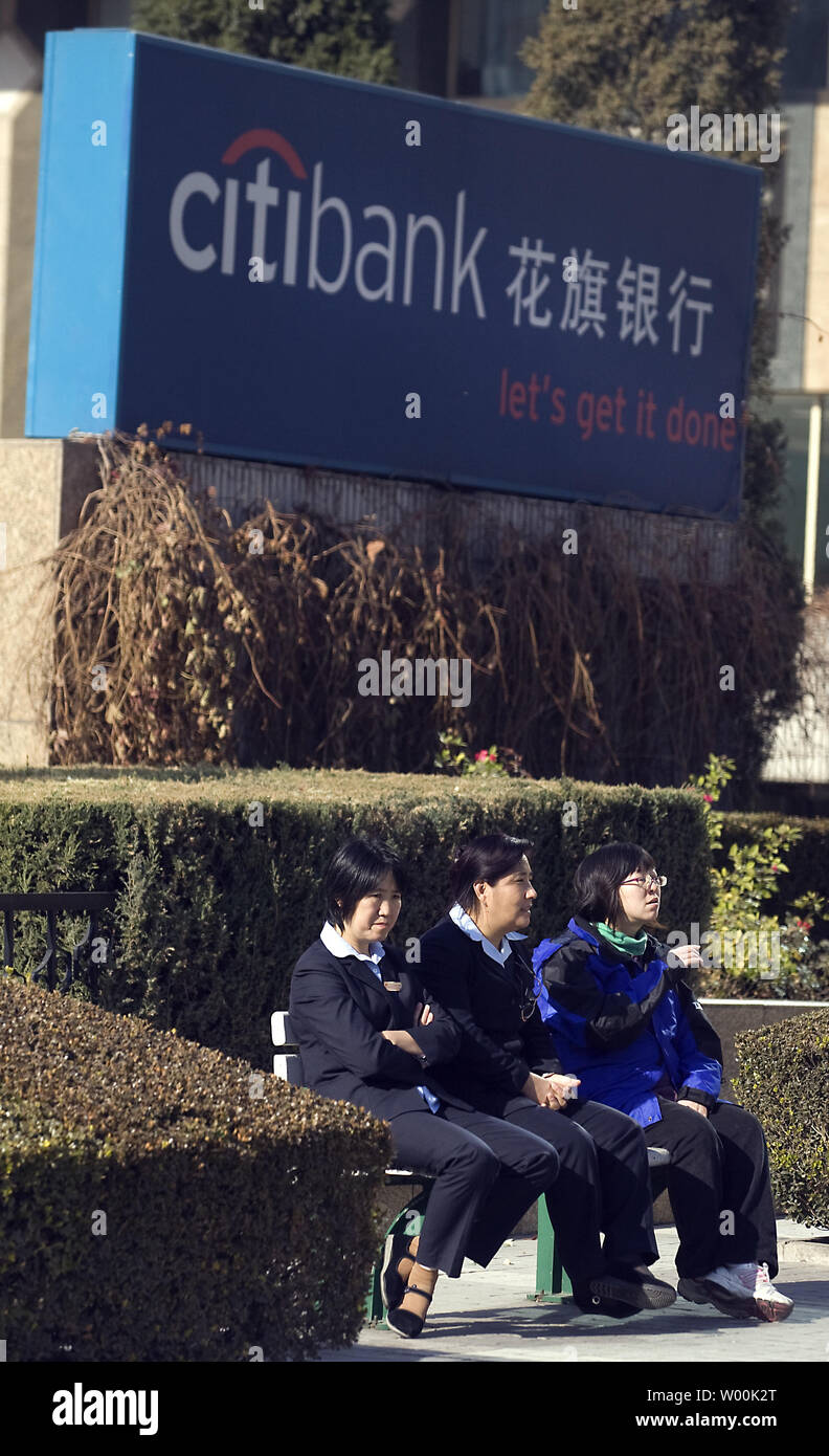 Chinese women sit on a bench in front a downtown Citibank branch in Beijing November 25, 2008.  Asia Pacific shares rose on Tuesday thanks to Wall StreetÕs overnight rally in relief at the CitibankÕs $300bn bailout.   (UPI Photo/Stephen Shaver) Stock Photo