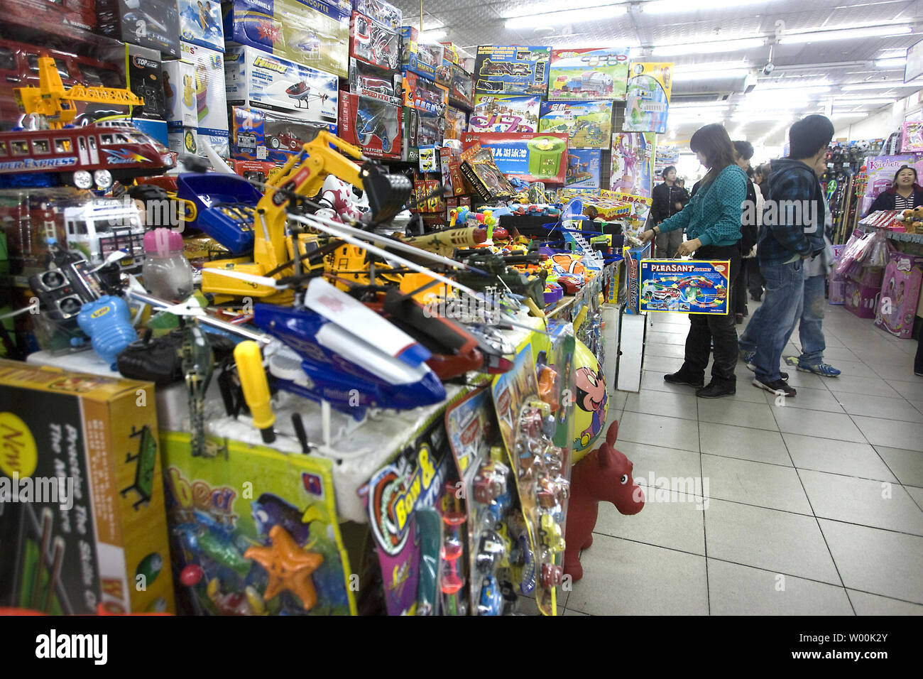 Chinese shop for 'made-in-China' toys at a popular toy outlet in central Beijing November 26, 2008.  Chinese toy makers must not accept orders based on unsafe foreign designs, the Foreign Ministry said on Tuesday, as the country seeks to assure quality ahead of Christmas.  (UPI Photo/Stephen Shaver) Stock Photo