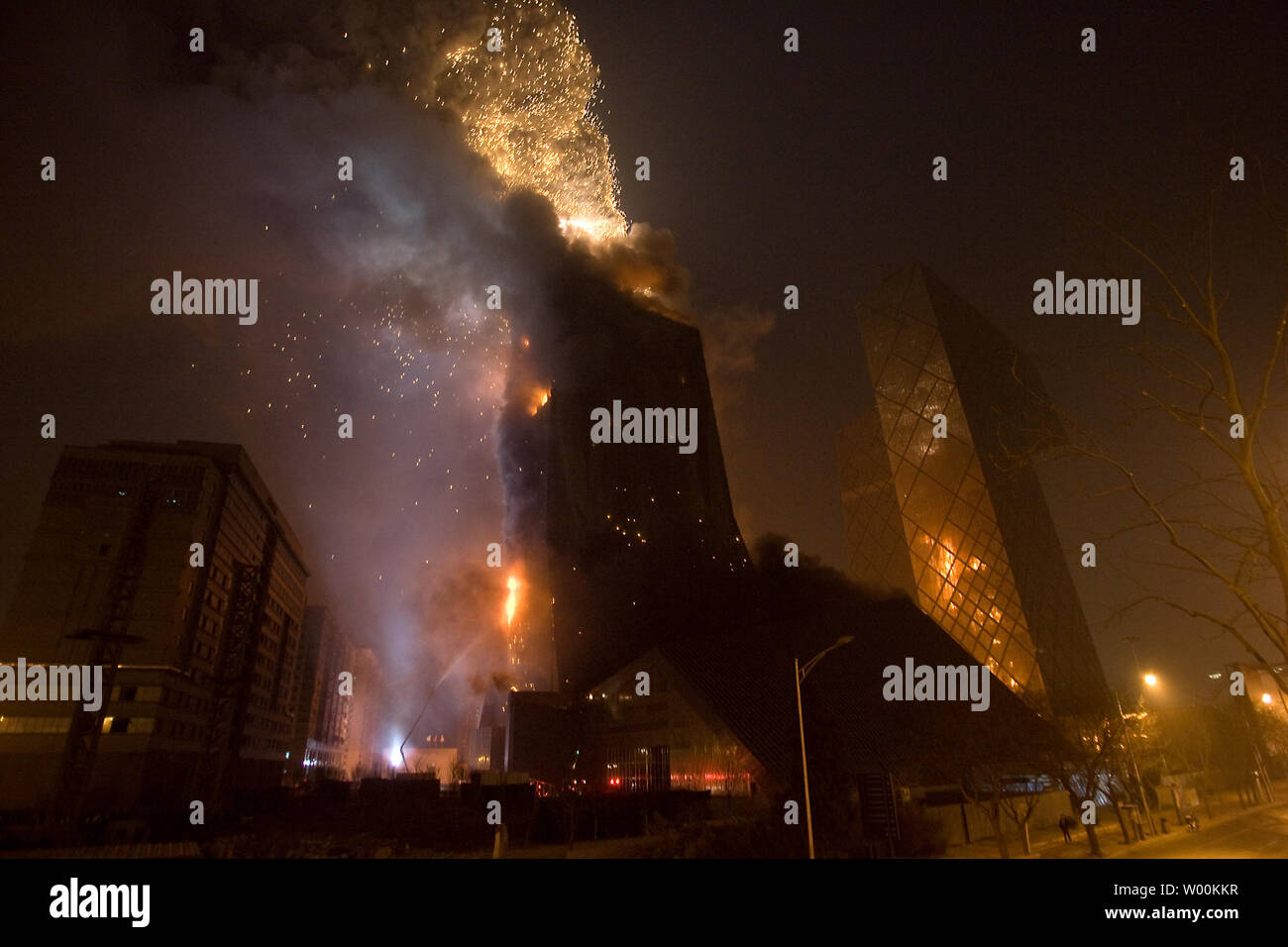 A larger blast rips through the roof as fire rages through the under-construction Mandarin Oriental hotel, which is part of China Central TelevisionÕs new headquarters complex in downtown Beijing February 09, 2009.   (UPI Photo/Stephen Shaver) Stock Photo