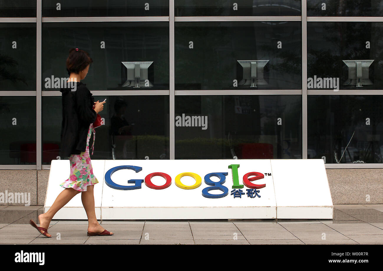 A Chinese woman walks past Google China's headquarters in Beijing on June 30, 2010.  China is threatening to revoke Google's China business license over the company's decision to redirect Chinese traffic to computer in Hong Kong that are now governed by the communist government's censorship practices.    UPI/Stephen Shaver Stock Photo