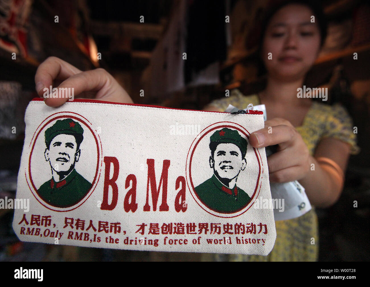 Money wallets and bags featuring U.S. President Barack Obama dressed in the Red Army communist fatigues of China's former helmsman Chairman Mao Zedong are being sold in shops in Beijing, September 14, 2010.  'Oba-Mao' t-shirts and accessories are big sellers in Beijing due to Obama's unflagging popularity among many Chinese.    UPI/Stephen Shaver Stock Photo