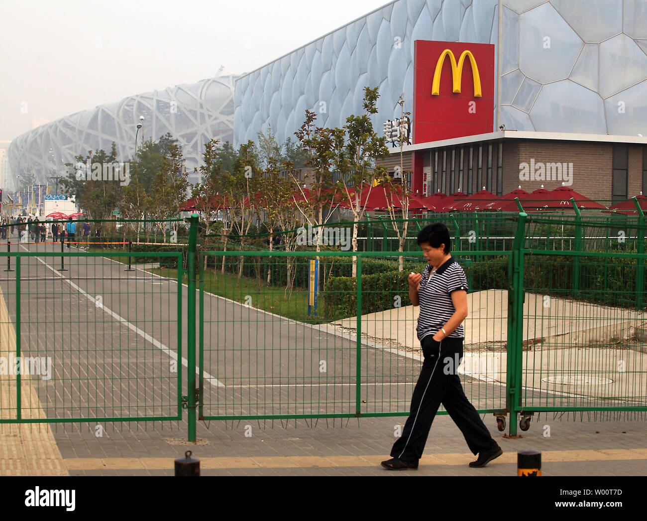 A new McDonald's restaurant sits on the Olympic Green next to China's National Aquatic Center, or Water Cube, and the country's National Stadium, or Bird's Nest, in Beijing September 30, 2010.  In a country that has taken pride in the delicacy and diversity of a cuisine which dates back thousands of years, it is astonishing that foreign fast food chains like McDonald's and Kentucky Fried Chicken are dominating the fast food industry in China.    UPI/Stephen Shaver Stock Photo