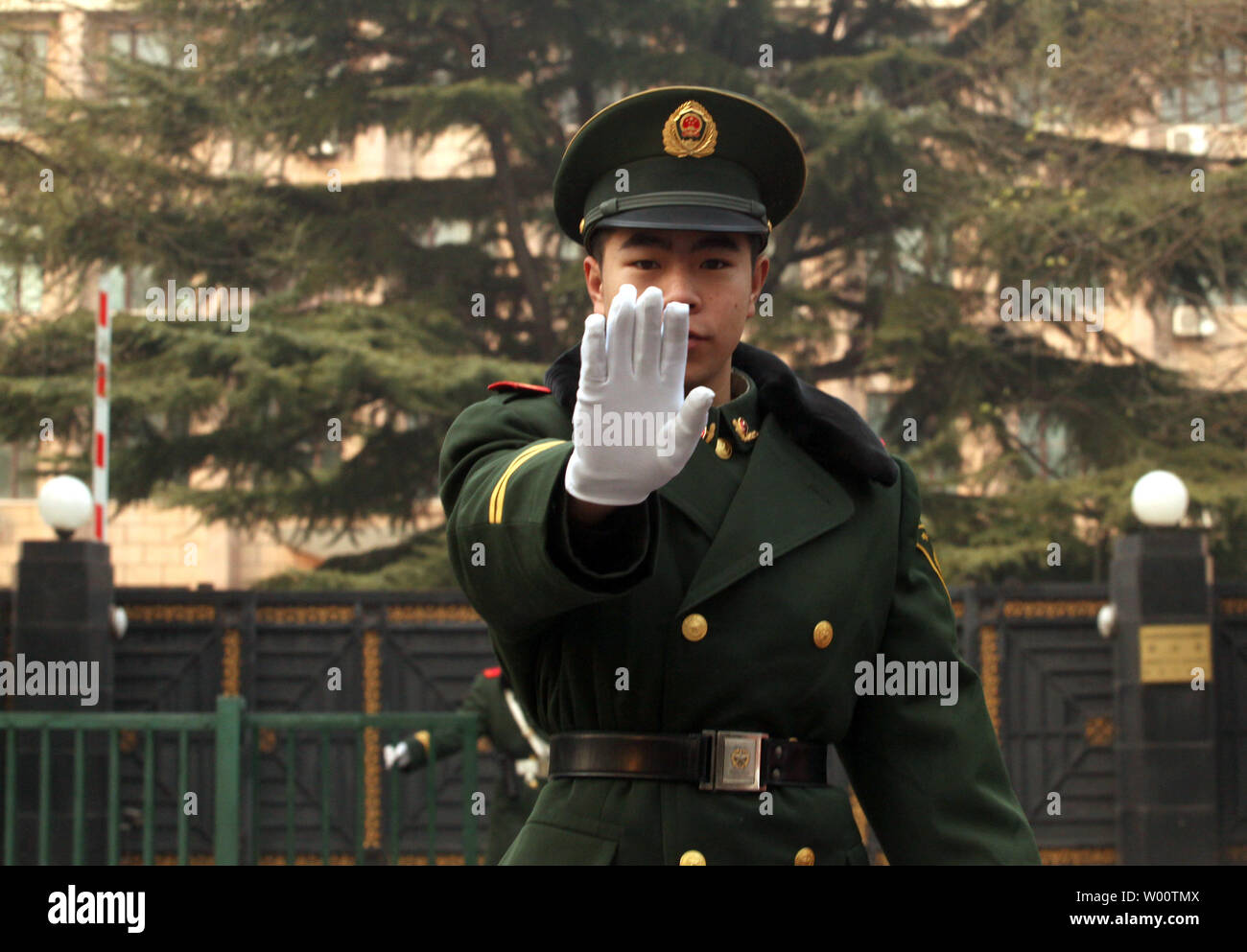 Chinese soldiers guard the North Korean embassy as a diplomat leaves the compound in Beijing November 29, 2010.  China remains Pyongyang's biggest trade partner and arguably has the most leverage on Kim Jon-Il's regime. North Korea placed surface-t-surface missiles on launch pads in the Yellow Sea, South Korea's state press said, as the United States and South Korea began military drills and China called for emergency talks.     UPI/Stephen Shaver Stock Photo