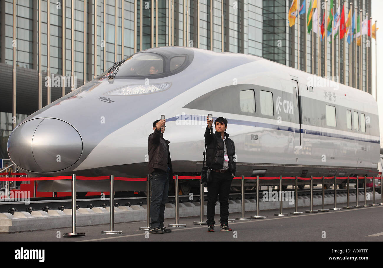 Visitors look at China's homegrown bullet train, the CRH380A, the train  that set an operating speed record of 302 miles per hour during a test run  on the Beijing-Shanghai line last week,