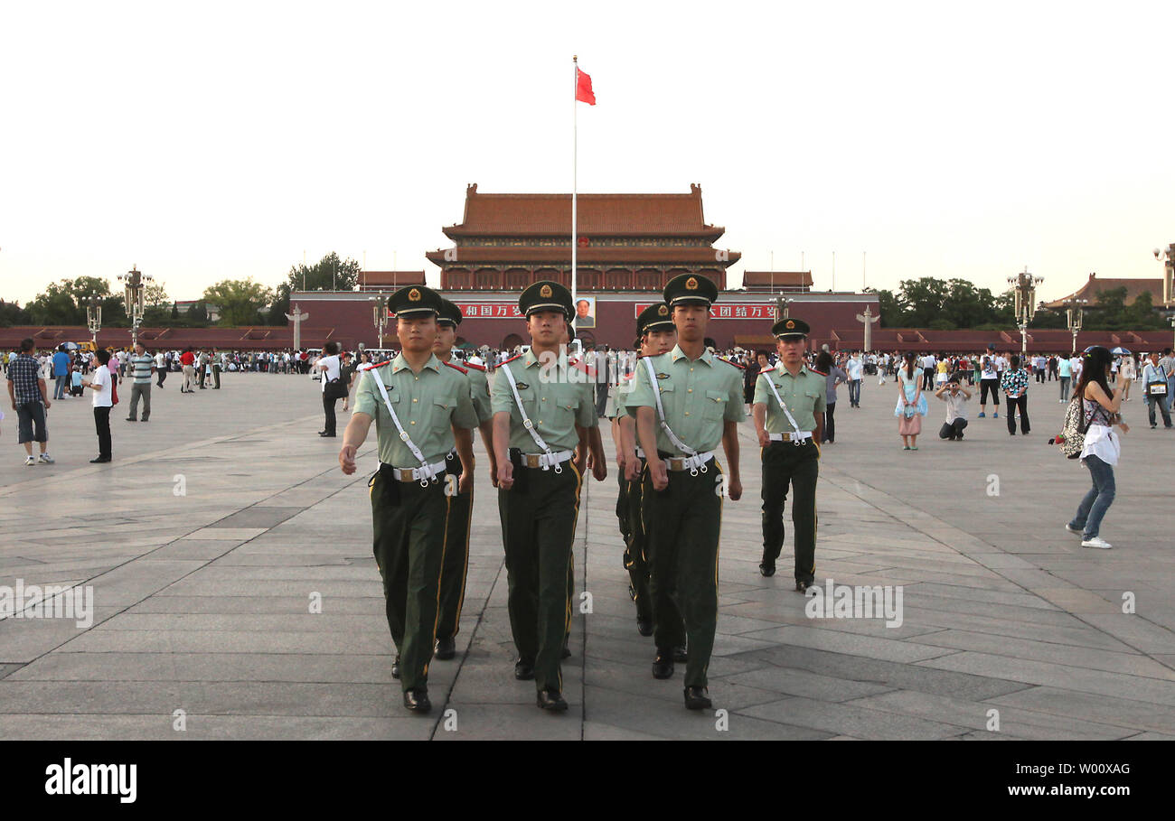 Chinese People's Liberation Army soldiers patrol Tiananmen Square in central Beijing on June 3, 2011.  China's capital is under heavy security in the lead up to the June 4 anniversary of the 1989 government crackdown on pro-democracy protests, which killed thousands of unarmed students.      UPI/Stephen Shaver Stock Photo
