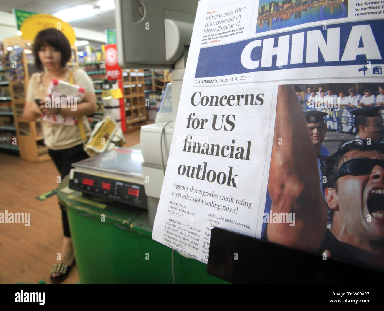 A Chinese Newspaper Featuring Front Page Coverage On The U S