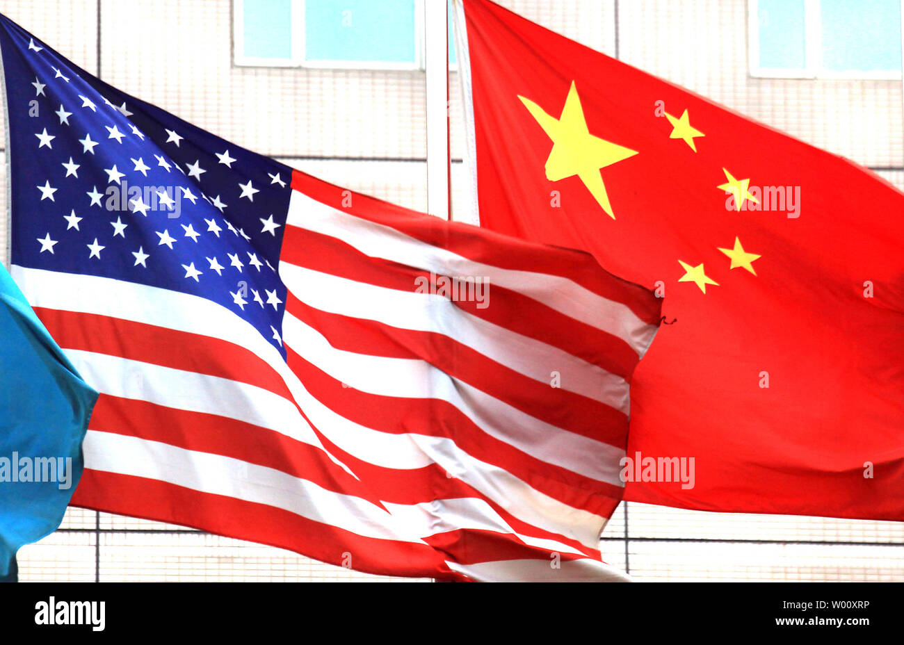 Both the American and Chinese national flags fly outside the hotel where U.S. Vice President Joe Biden will stay next week in Beijing on August 12, 2011. Biden will visit China's capital in the wake of the country's pointed criticism of Washington's failure to solve its debt crisis. UPI/Stephen Shaver Stock Photo
