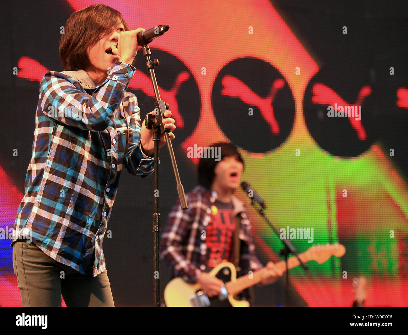 A Chinese rock band hired by Puma, a leading sports lifestyle company,  plays American music covers during a public marketing event at an  international fashion mall in Beijing November 5, 2011. Foreign