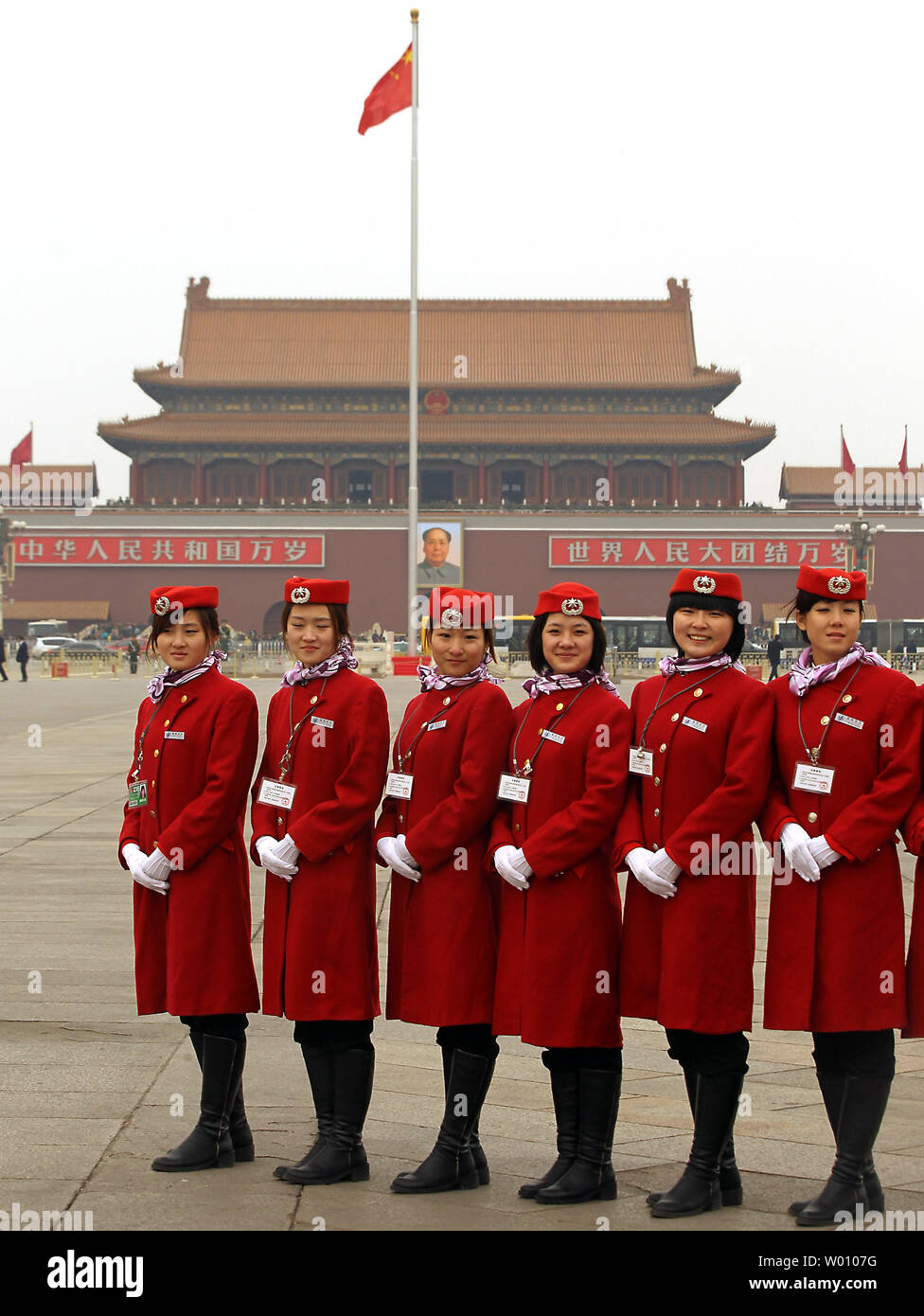 Chinese hostesses pose for a photo on Tiananmen Square ahead of the opening ceremony of the annual Chinese People's Political Consultative Conference (CPPCC) in Beijing March 3, 2012.  China's leaders face a parliament meeting next week likely to bring into focus a deepening worry that they have squandered their chance for reform because of fears of instability ahead of the upcoming change in leadership.     UPI/Stephen Shaver Stock Photo