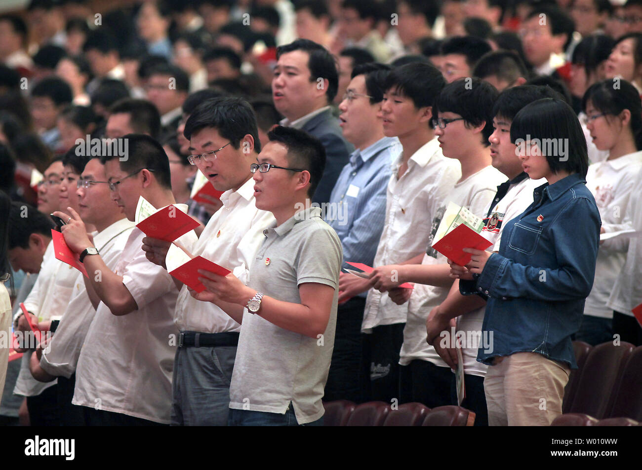 Chinese students sing patriotic songs during the 'Celebration of the 90th Anniversary of the Communist Youth League of China' being held in the Great Hall of the People in Beijing on May 4, 2012.  Recent events involving human rights and corruption have cast some doubt on the Chinese Communist Party's continued ability to maintain a firm grip on the state apparatus and Chinese society, according to both academics and analysts working in China.   UPI/Stephen Shaver Stock Photo