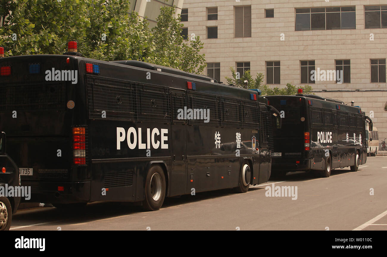 A row of riot-equipped police vehicles are parked near Beijing's Tiananmen Square as heavy security surrounded the square on the 33rd anniversary of the 1989 military crackdown on students, on June 4, 2012.  China has expressed 'strong dissatisfaction'' with a recent U.S. government statement urging the government to free student protestors imprisoned after the 1989 crackdown.      UPI/Stephen Shaver Stock Photo