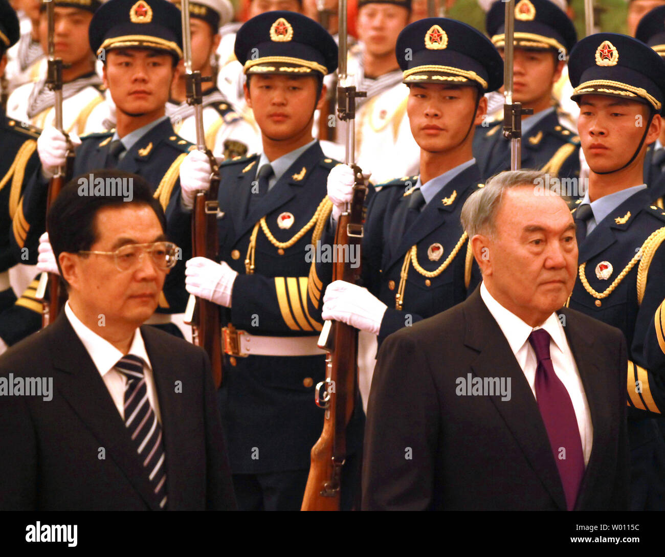 Chinese President Hu Jintao (L) escorts Kazakhstan's President Nursultan Nazarbayev past a military honor guard during a welcoming ceremony in the Great Hall of the People in Beijing on June 6, 2012.  Presidents from Tajikistan, Kyrgyzstan, Russia, Kazakhstan, Turkmenistan, Uzbekistan, Afghanistan, Pakistan and Iran are in China's capital for the 12th meeting of the Council of the Heads of the Shanghai Cooperation Organization Summit.      UPI/Stephen Shaver Stock Photo
