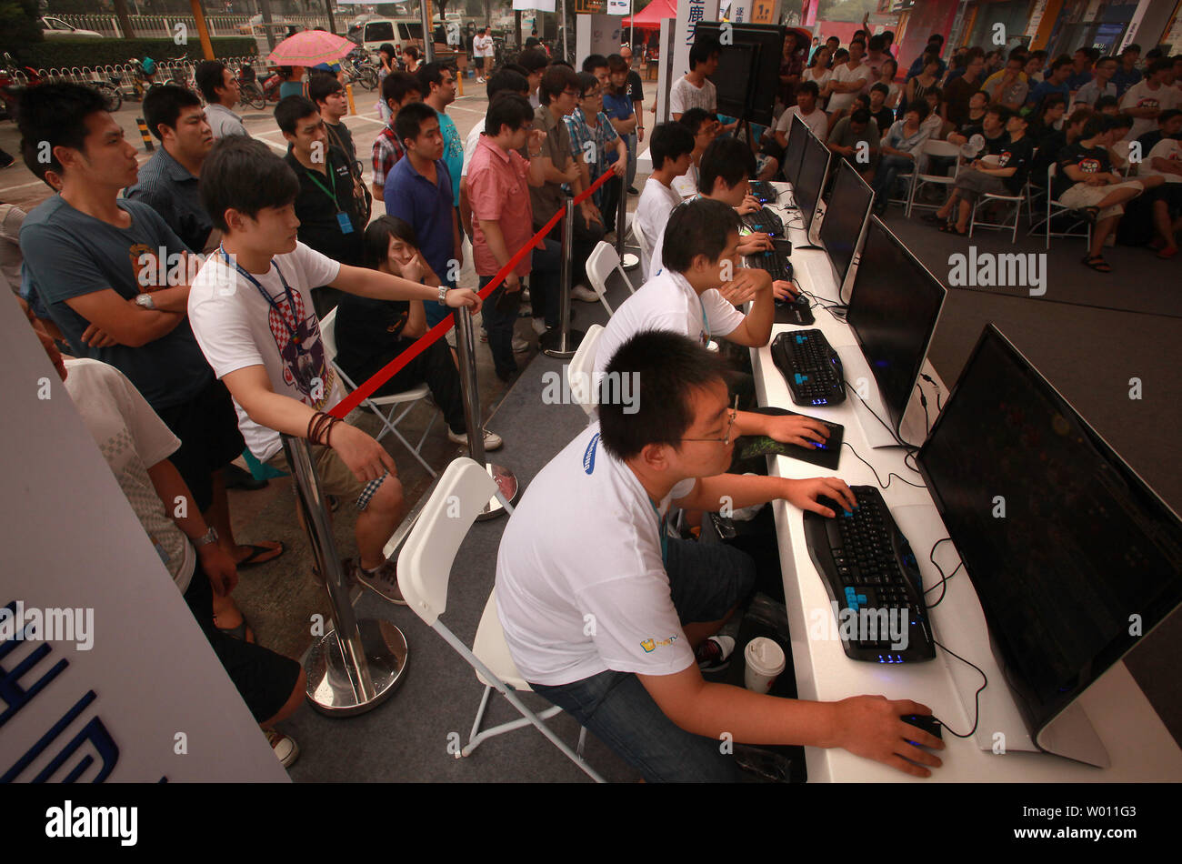 Chinese students compete in a cyber war-game contest in downtown Beijing on August 26, 2012.  Cyber crime in China poses a serious threat to the fast-growing economy and it is likely that such attacks, already costing in excess of US$850 billion a year, will only increase.    UPI/Stephen Shaver Stock Photo