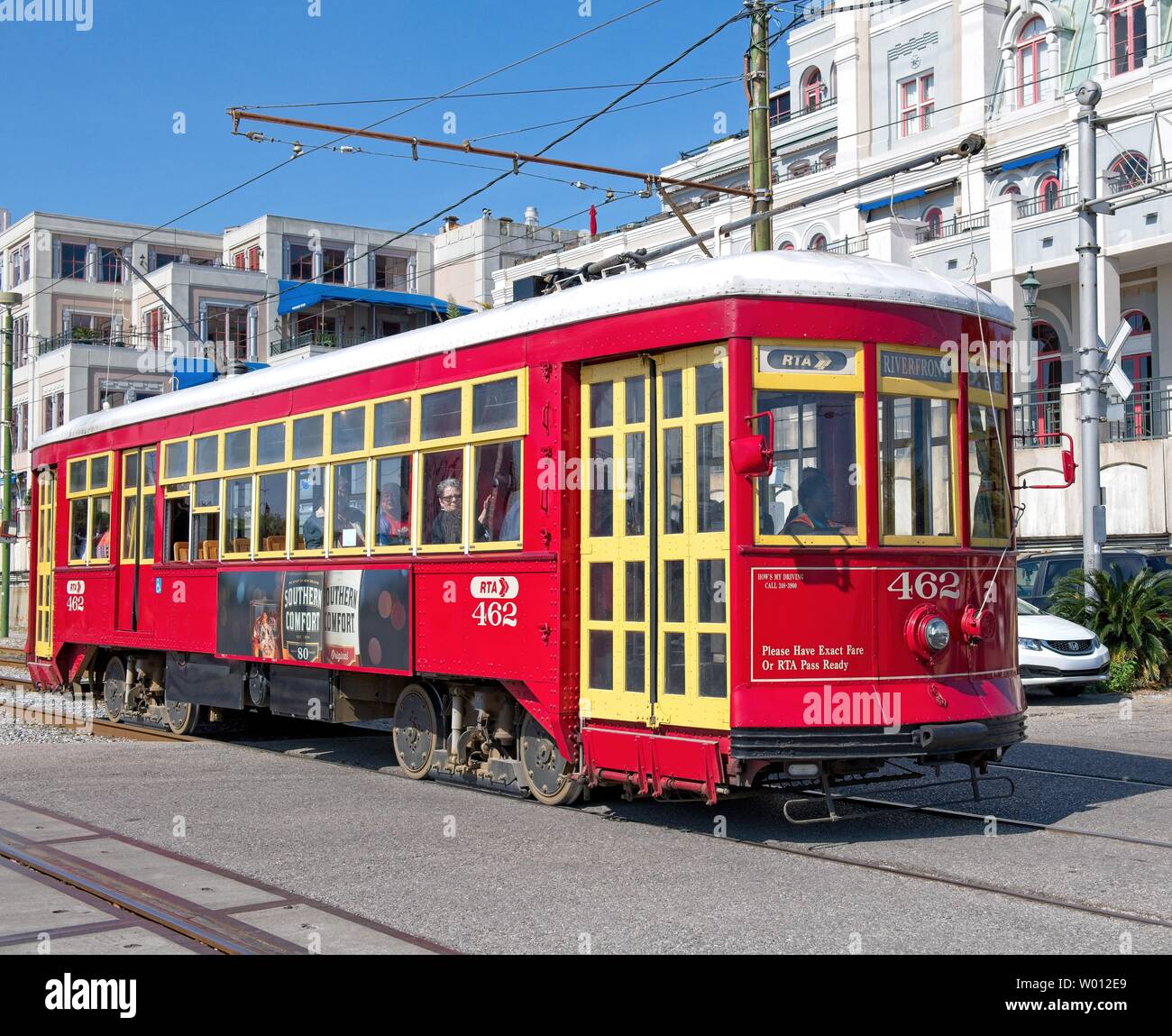 A red street car with yellow doors on the streets of New Orleans Stock Photo