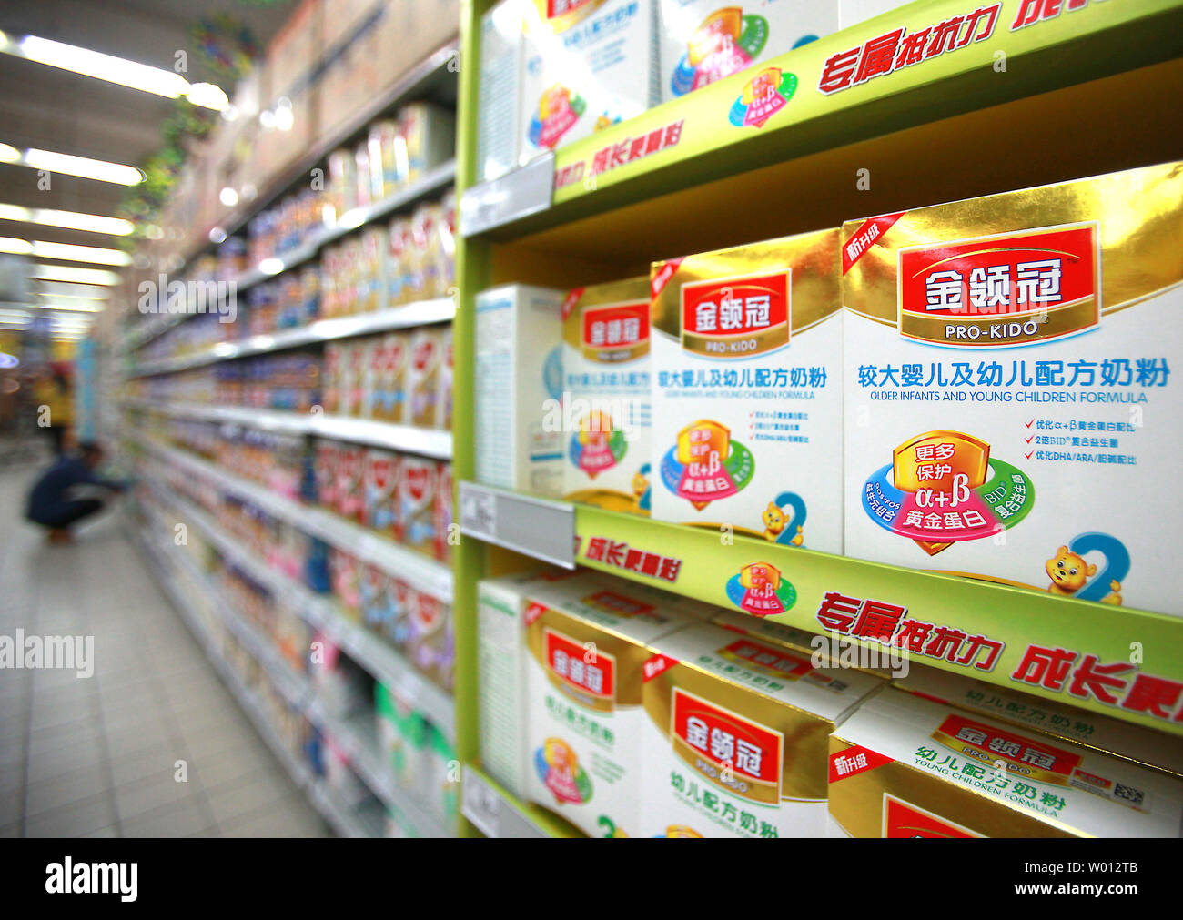 An international supermarket sells baby formula in downtown Beijing on April 9, 2013.  Retailers in Britain are rationing sales of baby formula because of a surge in demand for foreign-made milk in China due to domestic fears of contaminated Chinese products.     UPI/Stephen shaver Stock Photo