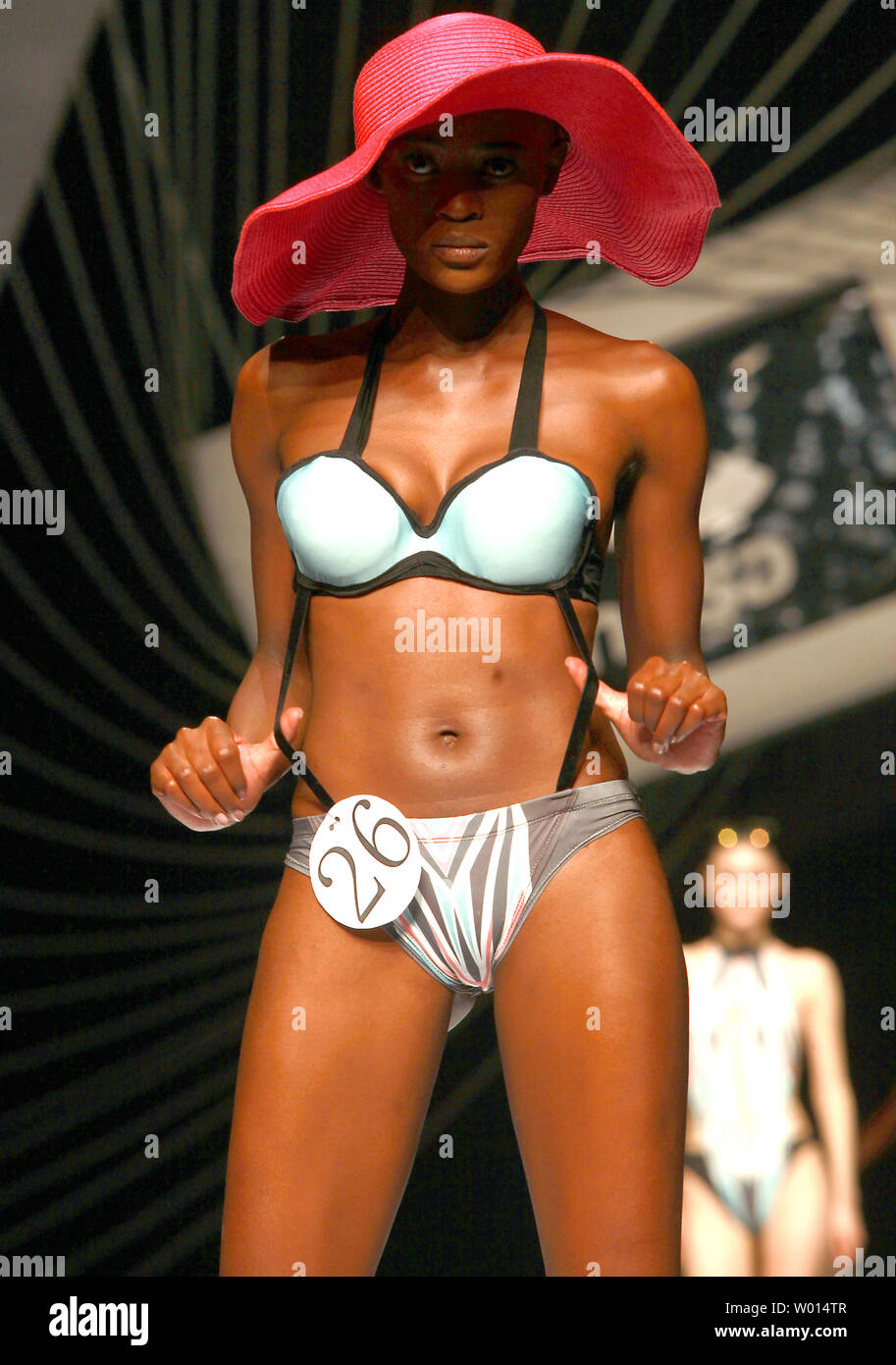 Models wear swimsuits made by students for a swimsuit design