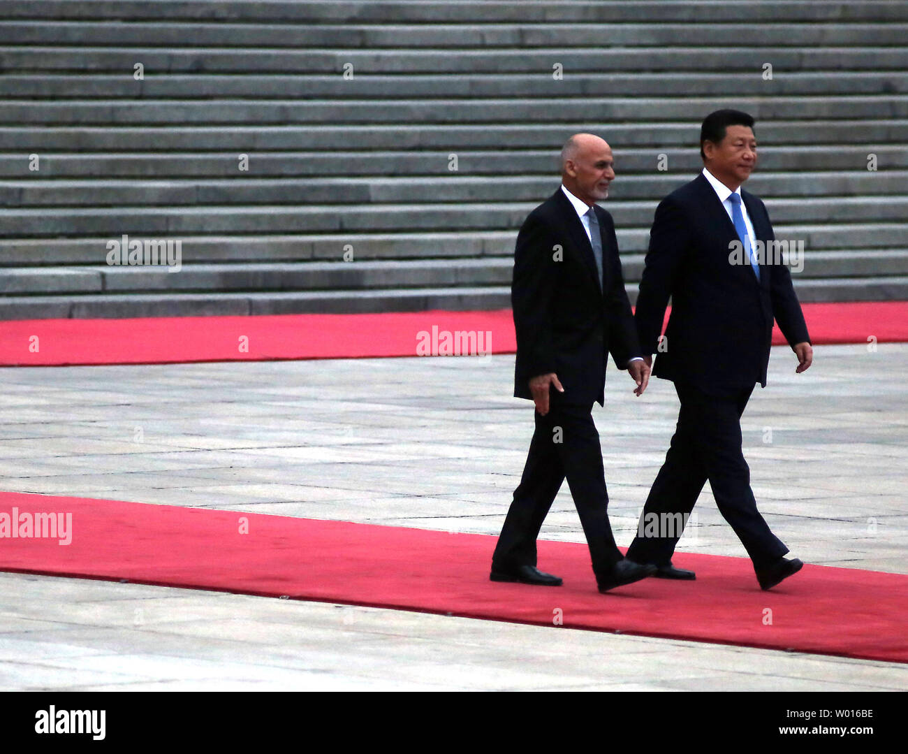 Afghanistan's new President Ashraf Ghani Ahmadzai (L) and Chinese President Xi Jinping attend a welcoming ceremony at the Great Hall of the People in Beijing on October 28, 2014.  The Afghan President is visiting China to seek help in rebuilding his country and boosting regional stability.       UPI/Stephen Shaver Stock Photo