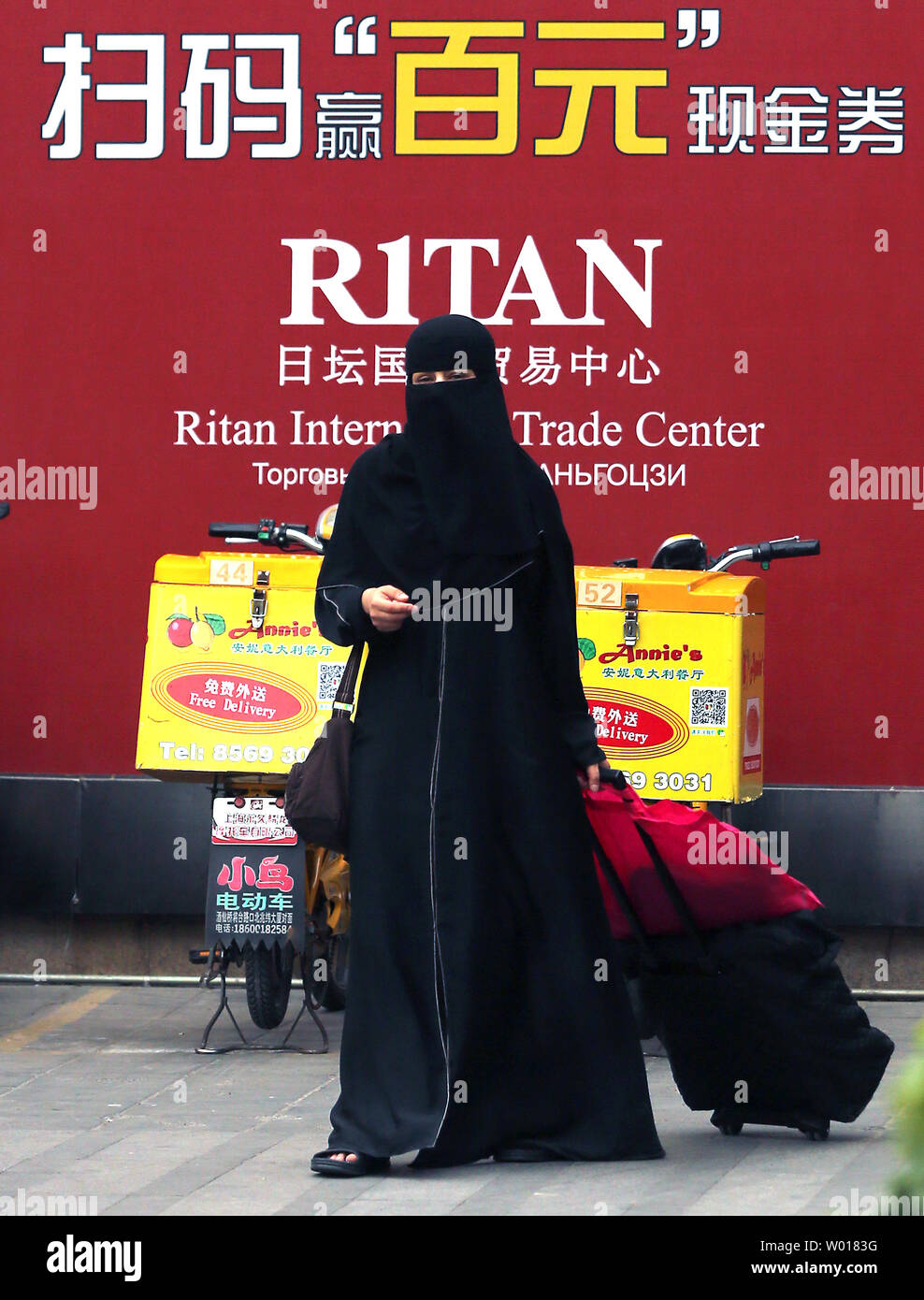 A Woman Wears A Burqa As She Shops In Central Beijing On June 21 15 Government Authorities In Urumqi The Muslim Capital Of Xinjiang Province Has Banned Women From Wearing The Burqa A Woman Wears A Burqa As She Shops In Central Beijing On June 21 15 Government Authorities In Urumqi The Muslim Capital Of Xinjiang Province Has Banned Women From Wearing The Burqa