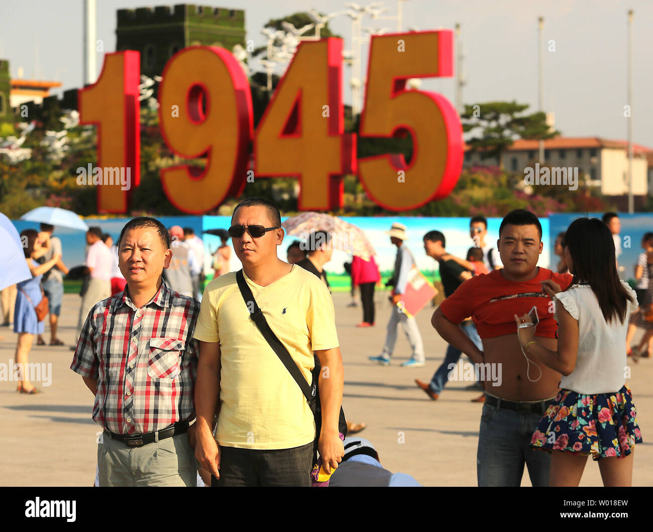 Chinese tourists visit Tiananmen Square, which is being decorated for the upcoming military parade commemorating the end of World War Two, in Beijing on August 20, 2015.  China will showcase its military might with a massive military parade next month as the country takes a three-day holiday to commemorate the defeat of Japan in 1945.     Photo by Stephen Shaver/UPI Stock Photo