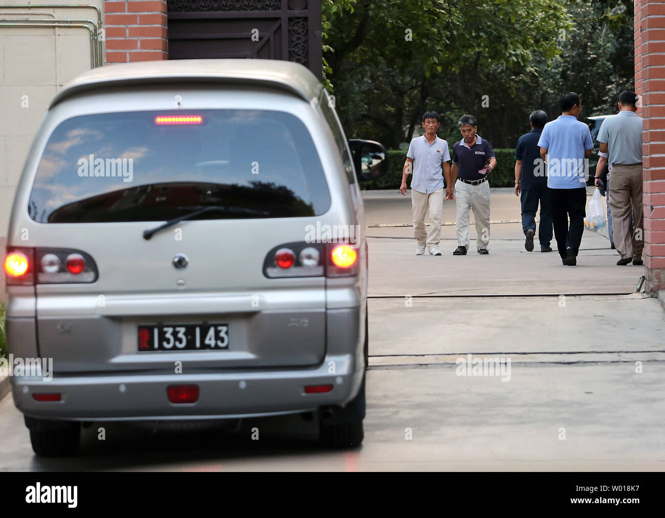 North Koreans are seen entering and leaving their embassy in Beijing on August 26, 2015.  Despite China being North Korea's lifeline regarding energy, food and international diplomacy, North Korean leader Kim Jong Un declined an invitation to a attend a military parade commemorating China's victory over Japan during World War II.  The snub was announced amid escalating military tensions between North and South Korea.    Photo by Stephen Shaver/UPI Stock Photo