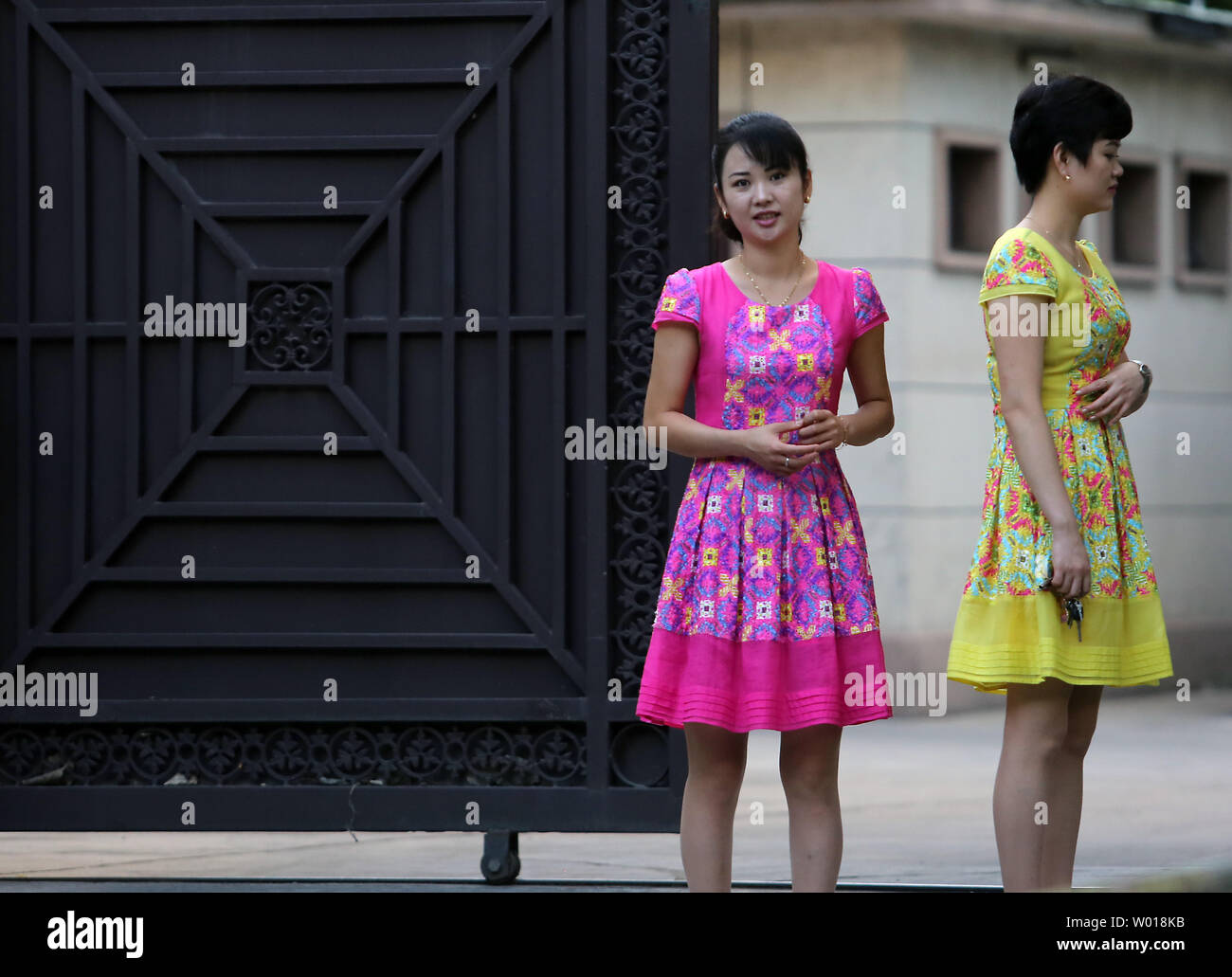 North Korean women wait for a delivery at their embassy in Beijing on August 26, 2015.  Despite China being North Korea's lifeline regarding energy, food and international diplomacy, North Korean leader Kim Jong Un declined an invitation to a attend a military parade commemorating China's victory over Japan during World War II.  The snub was announced amid escalating military tensions between North and South Korea.    Photo by Stephen Shaver/UPI Stock Photo