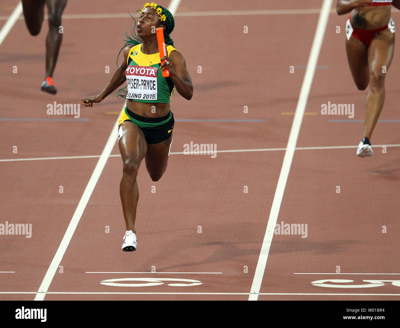 Jamaica's Shelly-Ann Fraser-Pryce wins the final leg of the 4x100 meters women's relay final at the IAAF World Championships being hosted by Beijing on August 29, 2015.  Jamaica won with a time of 41.07 seconds, followed by USA (41.68) and Trinidad and Tobago (42.03) in third.     Photo by Stephen Shaver/UPI Stock Photo