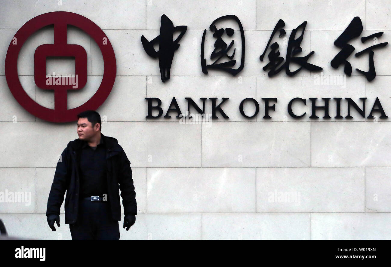Chinese visit a Bank of China branch in downtown Beijing on January 5, 2016.  China's major stock exchanges  tanked on the first trading day of the year on Monday, triggering a 'circuit-breaker' that stopped equities trade nation-wide.  China struggled to shore up shaky sentiment a day after its stock indexes and yuan currency tumbled, rattling markets worldwide.     Photo by Stephen Shaver/UPI Stock Photo