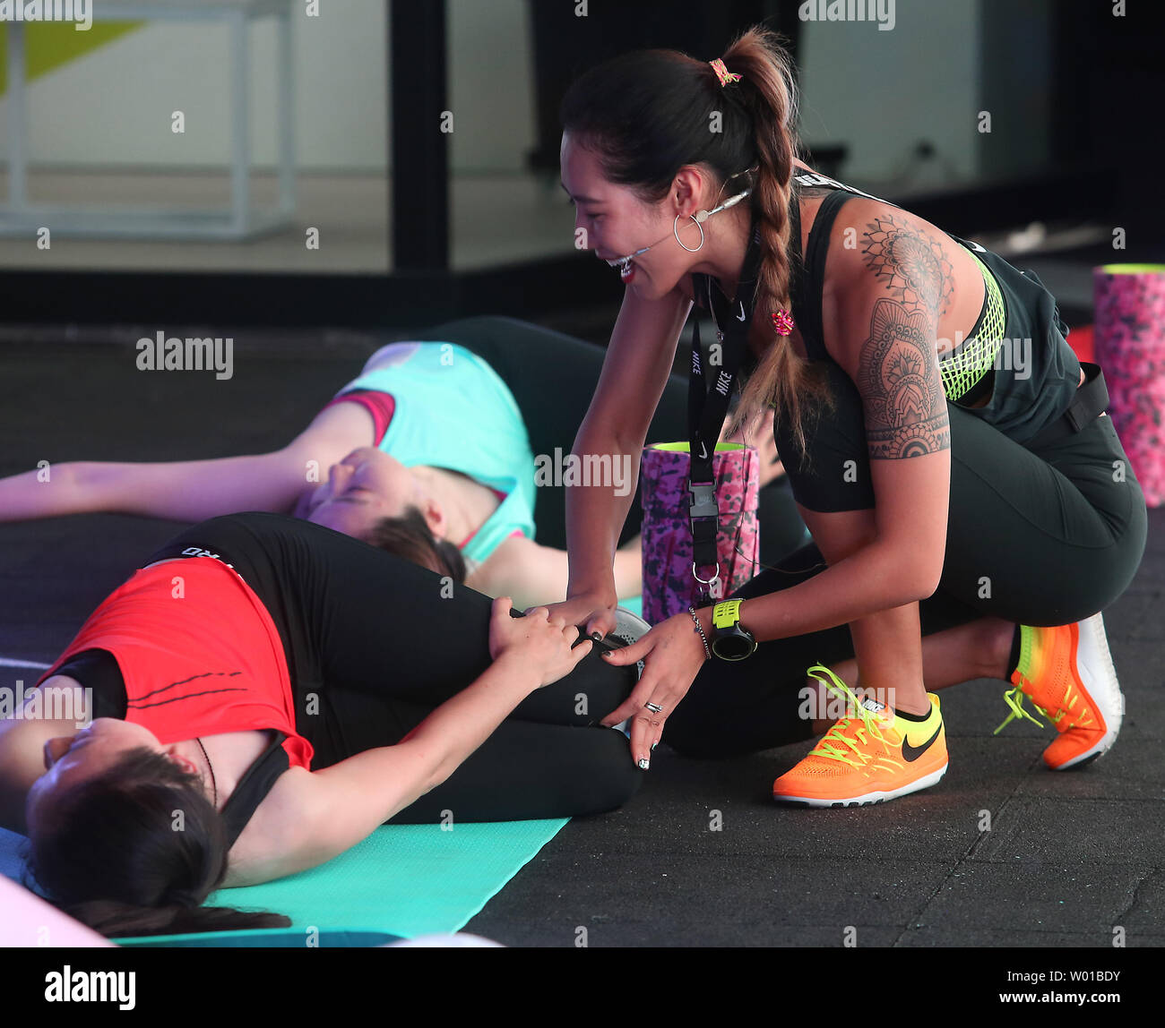 A Chinese fitness instructor encourages 