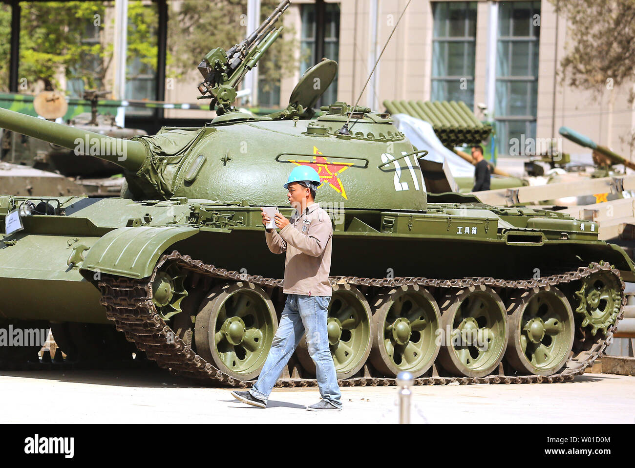 A Chinese worker walks by a tank on display at the Chinese Military Museum of the People's Revolution in Beijing on April 29, 2017.  Chinese President Xi Jinping told U.S. President Donald Trump China is strongly against any action that would violate UN Security Council resolutions and added that the North Korean nuclear issue can be solved if all parties take responsibility and work together, according to state media.     Photo by Stephen Shaver/UPI Stock Photo