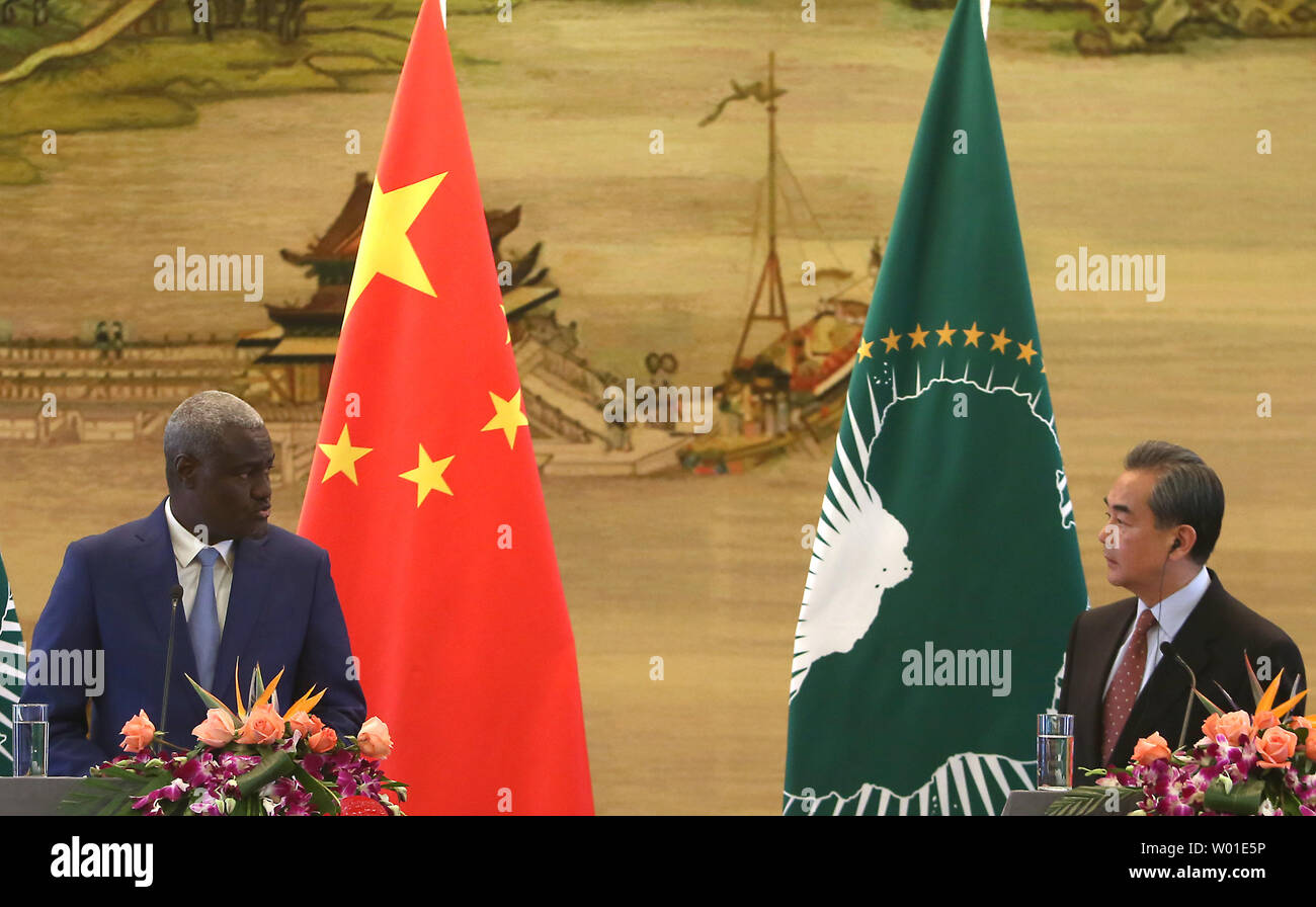Chinese Foreign Minister Wang Yi (R) holds a press conference with visiting Chairperson of the African Union Commission Moussa Faki Mahamat in Beijing on February 8, 2018.  Moussa dismissed a French newspaper report alleging that China had spied on the continental body as 'lies'.    Photo by Stephen Shaver/UPI Stock Photo