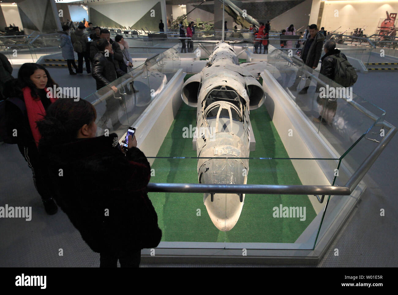 Chinese visitors look at a captured U.S.U2 spy plane on display at the Military Museum in Beijing on February 6, 2018. China, which maintains the largest standing army in the world, has successfully conducted another anti-missile test amide rising tensions over North Korea's nuclear weapons program and the militarization of the South China Sea.   Photo by Stephen Shaver/UPI Stock Photo