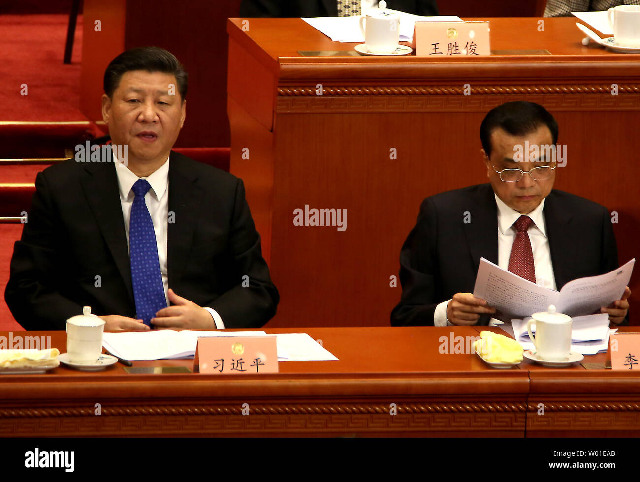 Chinese President Xi Jinping (L) and Premier Li Keqiang attend the 1st session of the 13th Chinese People's Political Consultative Conference (CPPCC) in the Great Hall of the People in Beijing on March 3, 2018.  The annual 'rubber-stamp' congress is held to support the Communist Party's hold on politics and policies.  China has expressed 'grave concern' about a U.S. trade policy that pledges to pressure Beijing on steel and aluminum tariffs.      Photo by Stephen Shaver/UPI Stock Photo