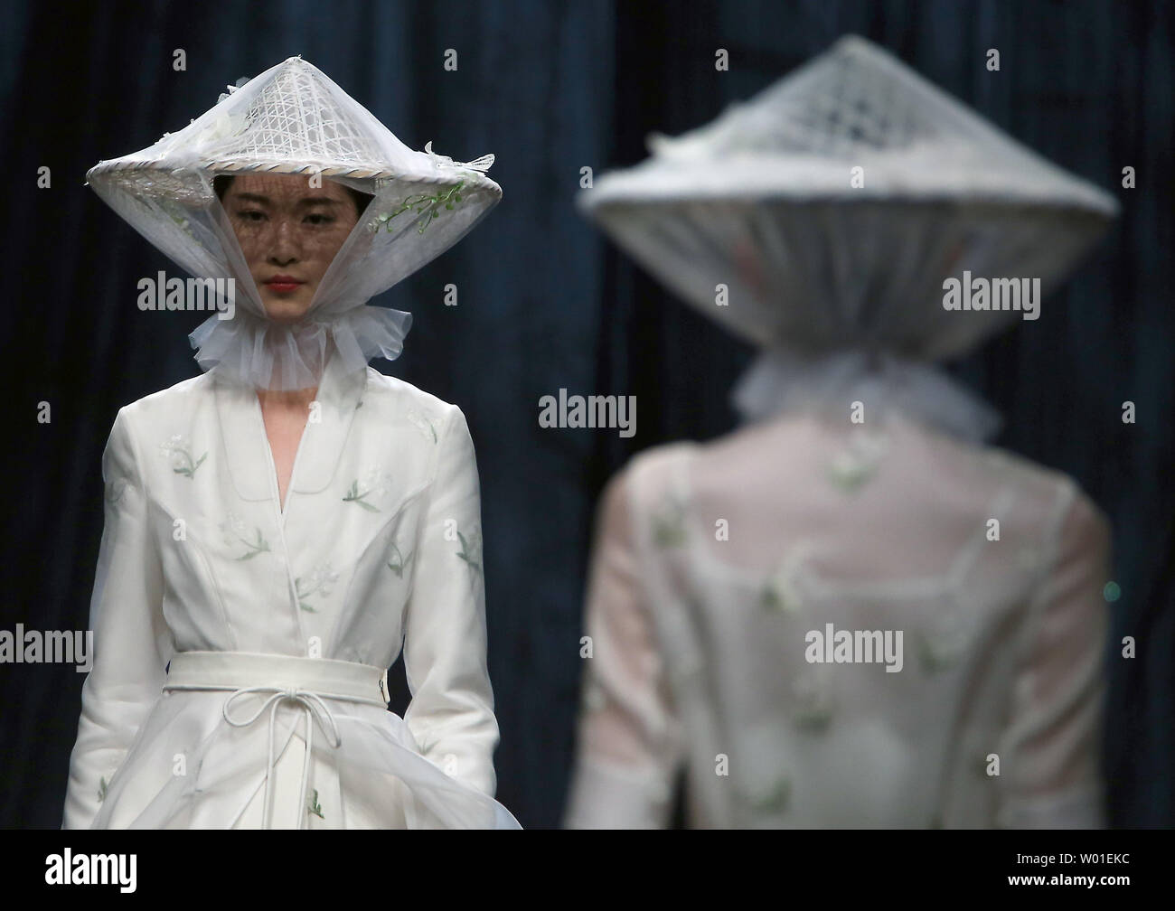 Models wear clothing by designer Xiong Ying during the annual China Fashion Week in Beijing on April 1, 2018.  An increasing number of Chinese fashion designers are gaining international recognition for their creativity and modernism.    Photo by Stephen Shaver/UPI Stock Photo