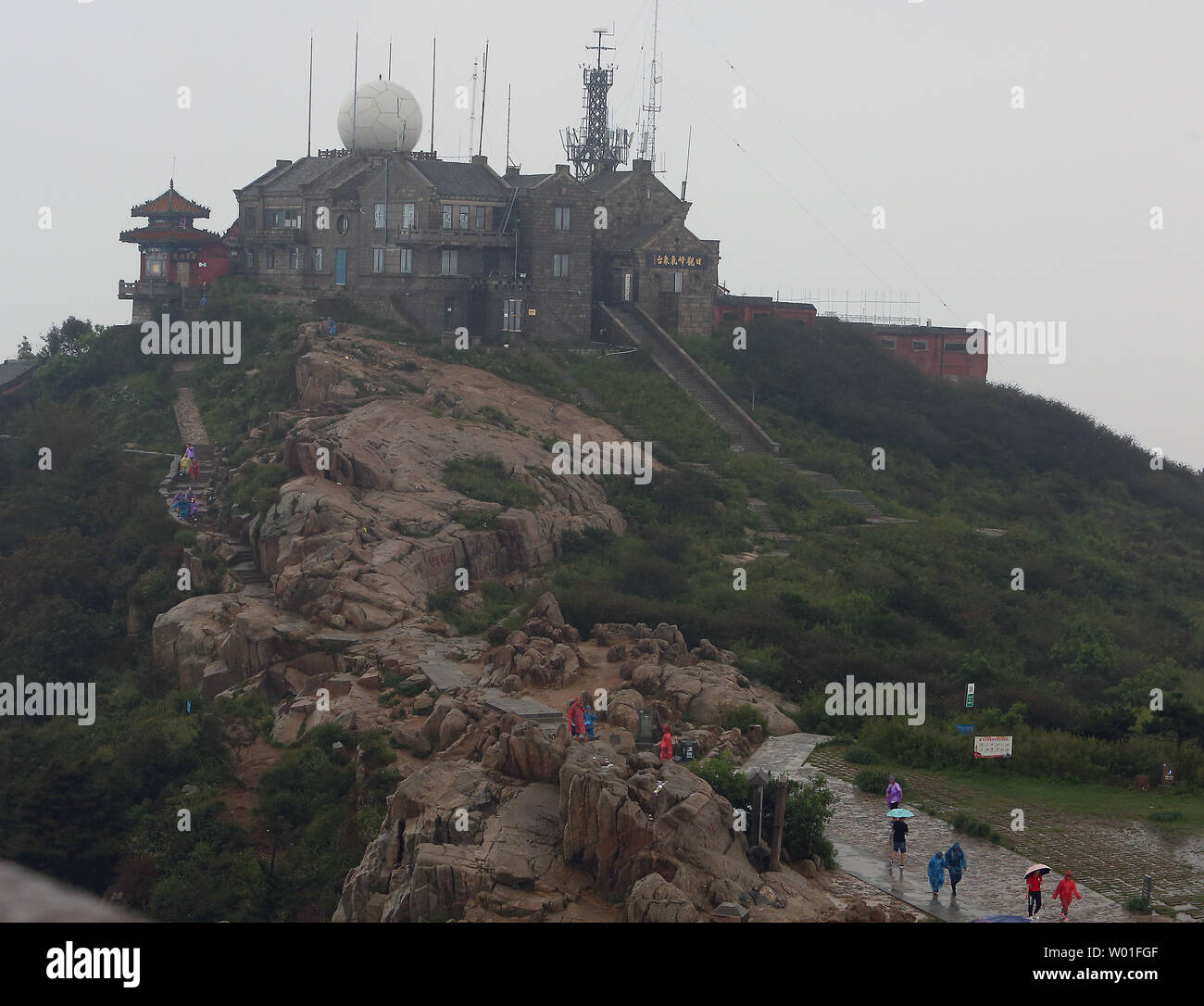 Chinese and foreign tourists brave the weather to visit and climb Mount Tai in Tai'an, Shandong Province, August 25, 2018.  Known as the 'No.1 of the Five Great Mountains of China,' Mount Tai is traditionally where people prayed for peace and prosperity.      Photo by Stephen Shaver/UPI Stock Photo