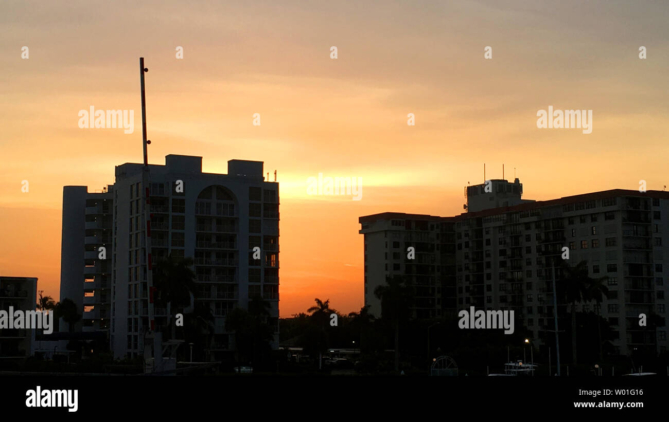 Sunset view with a cityscape and orange sun color Stock Photo