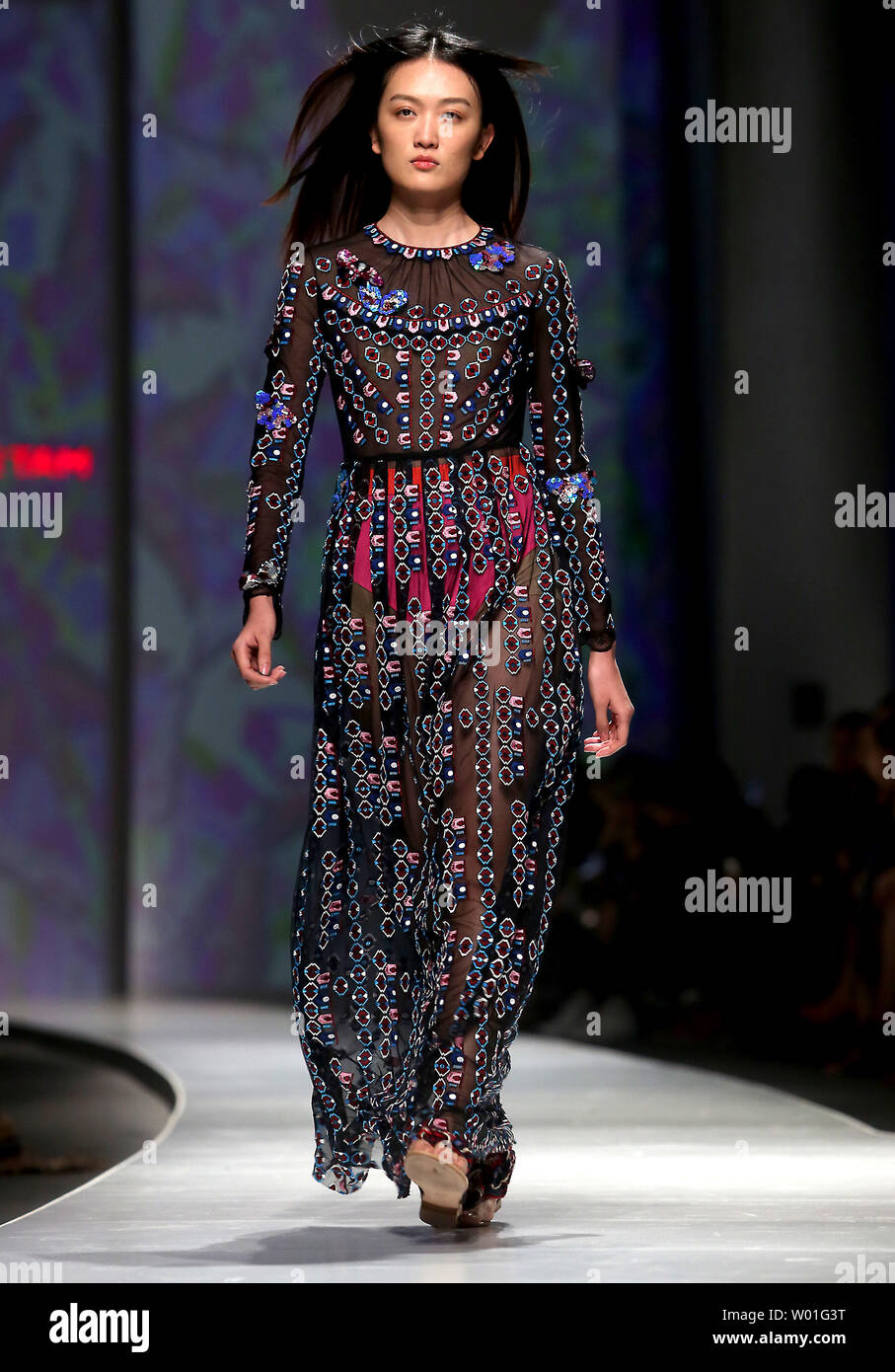 Models wear the latest designs from Vivienne Tam during the annual ...