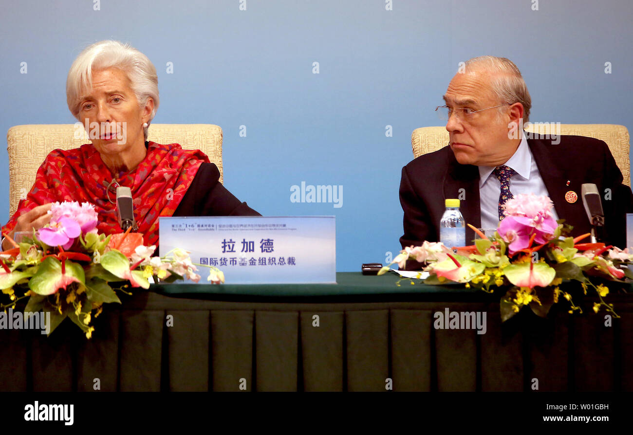 Organization for Economic Cooperation and Development (OECD) Secretary-General Angel Gurria (R) listens to International Monetary Fund (IMF) Managing Director Christine Lagarde speak at a joint press conference at The Third '1+6' Roundtable in Beijing on November 6, 2018.  The group called for 'improved global economic governance based on the principles of consultation, cooperation and benefit for all.'  The group also expressed concern of trade protectionism.    Photo by Stephen Shaver/UPI Stock Photo