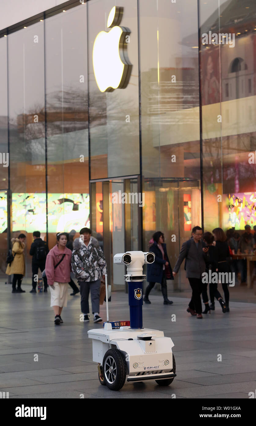 A police surveillance robot keeps watch on crowds on the streets of downtown Beijing on February 27, 2019.  China's capital is ratcheting up security in popular tourist and shopping areas as the government's leaders are due to hold the annual Congress next week.   Photo by Stephen Shaver/UPI Stock Photo