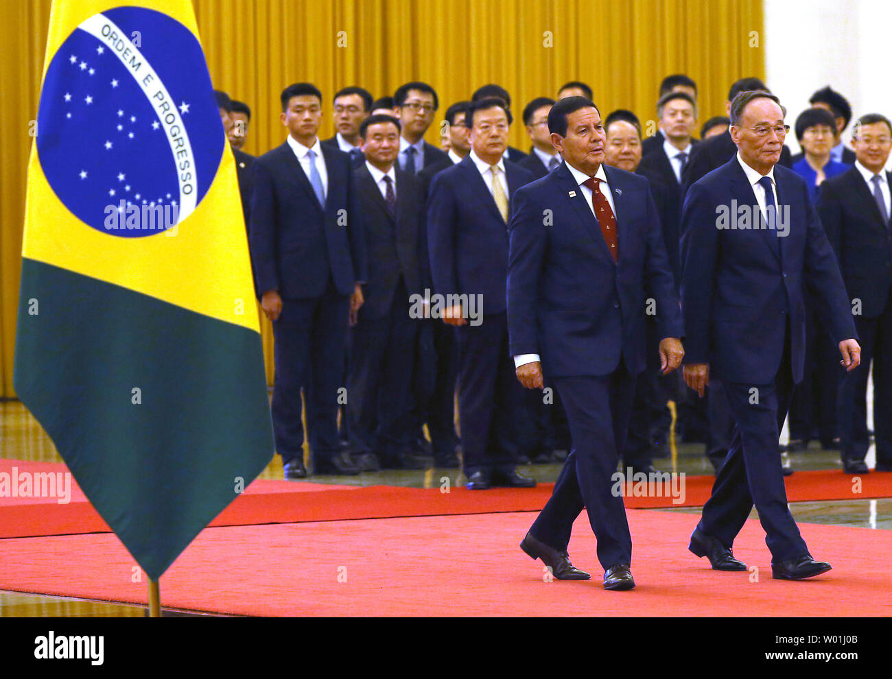 Brazilian Vice-President Hamilton Mourao (L) is escorted by Chinese Vice-President Wang Qishan to a welcoming ceremony in the Great Hall of the People in Beijing on May 23, 2019.  Mourao is on a five-day state visit to China's capital in hopes of patching up wounds caused by Brazilian President Jair Bolsonaro's abrasive anti-China rhetoric.      Photo by Stephen Shaver/UPI Stock Photo