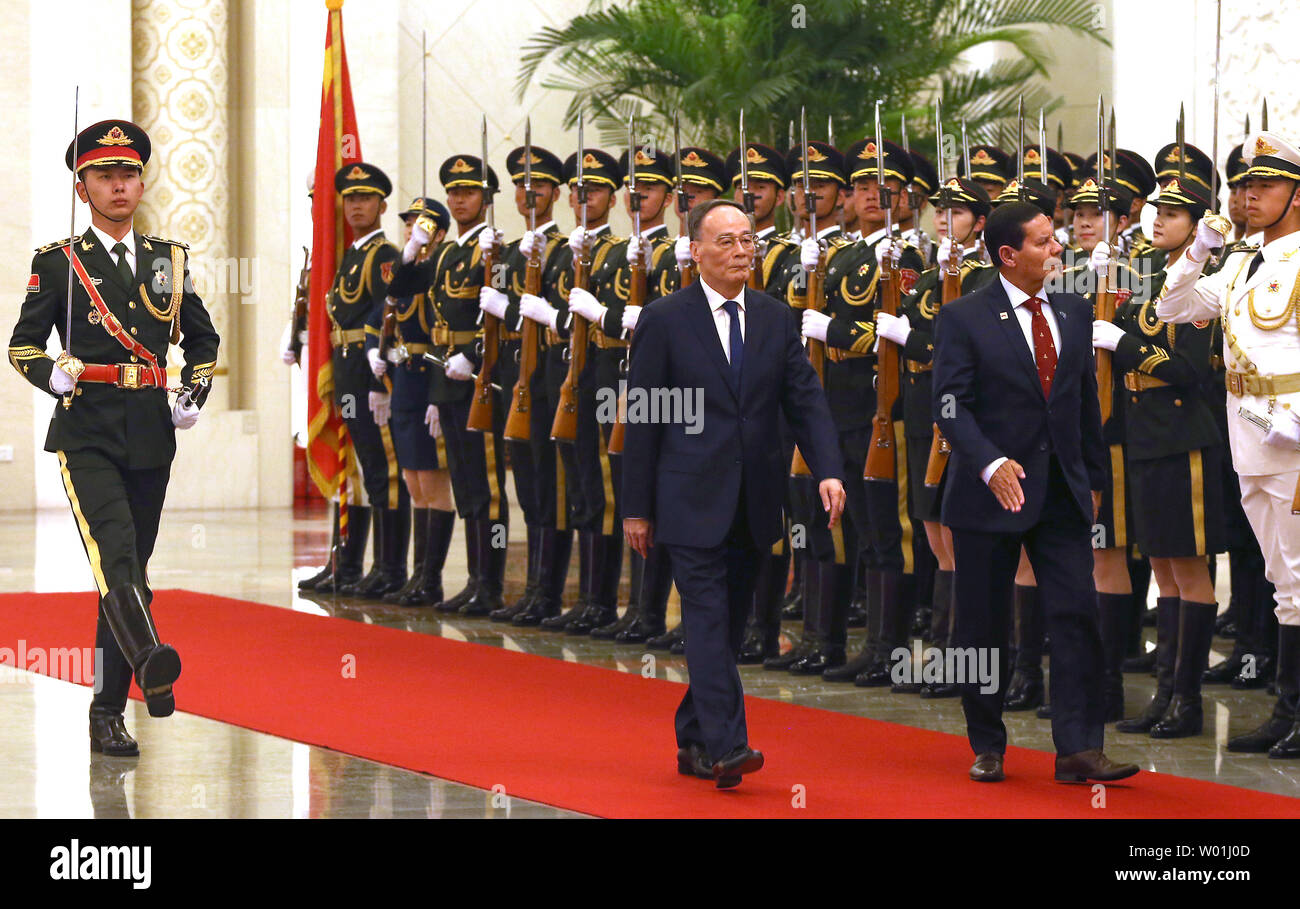 Brazilian Vice-President Hamilton Mourao (R) and Chinese Vice-President Wang Qishan inspect a military honor guard during a welcoming ceremony in the Great Hall of the People in Beijing on May 23, 2019.  Mourao is on a five-day state visit to China's capital in hopes of patching up wounds caused by Brazilian President Jair Bolsonaro's abrasive anti-China rhetoric.      Photo by Stephen Shaver/UPI Stock Photo