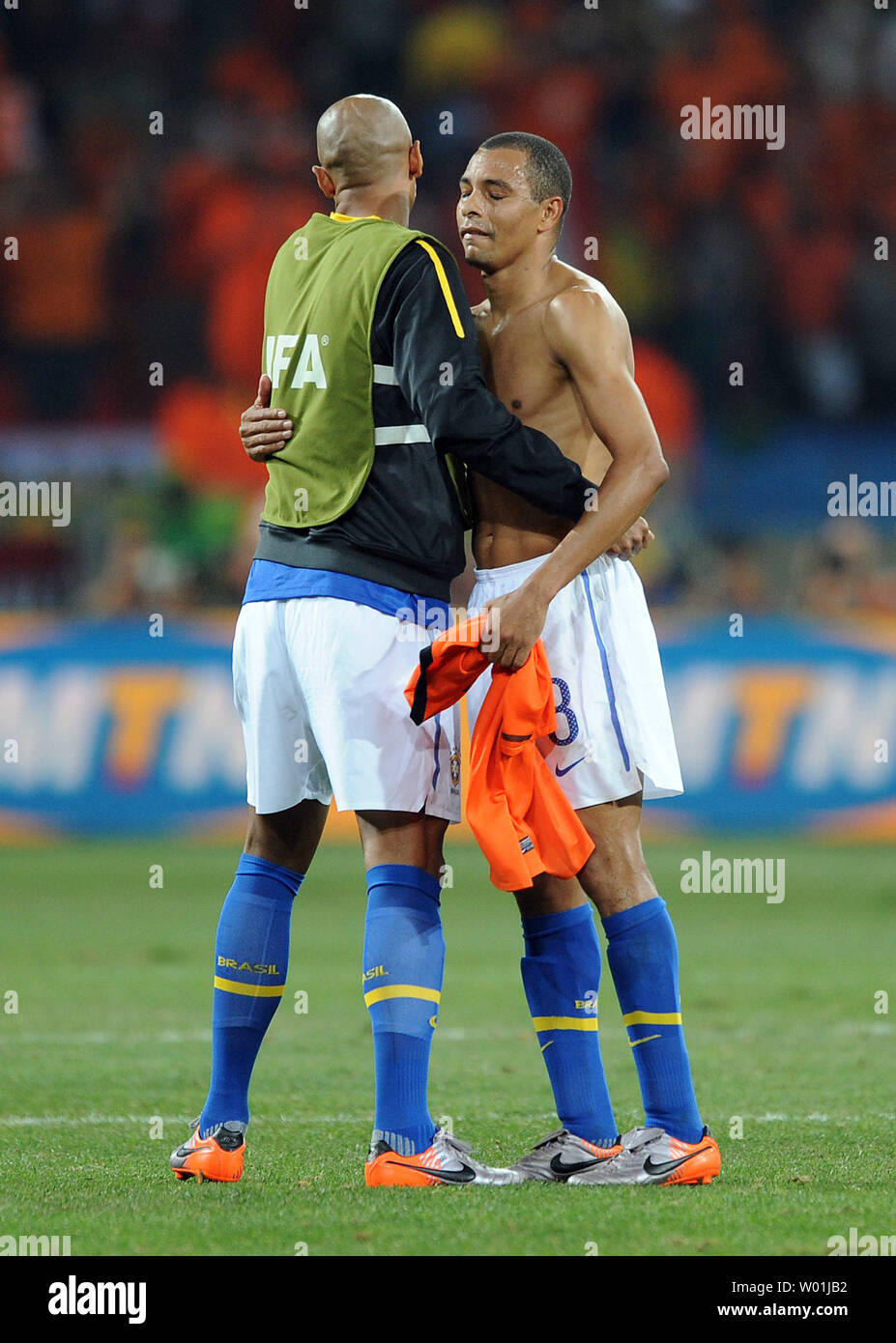 Gilberto Silva of Brazil is consoled by team-mate Luisao after The Netherlands beat Brazil 2-1 at the FIFA World Cup Quarter Final match at the Nelson Mandela Bay Stadium in Port Elizabeth, South Africa on July 2, 2010. . UPI/Chris Brunskill Stock Photo