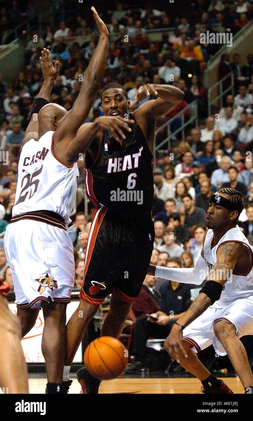 The Heats' Eddie Jones (6) is stripped of the ball by the 76ers Marc Jackson (25) and Allen Iverson (3) as Philadelphia hosts Miami in the season opening game at the Wachovia Center in Philadelphia, on October 28, 2003. (JON ADAMS/UPI) Stock Photo