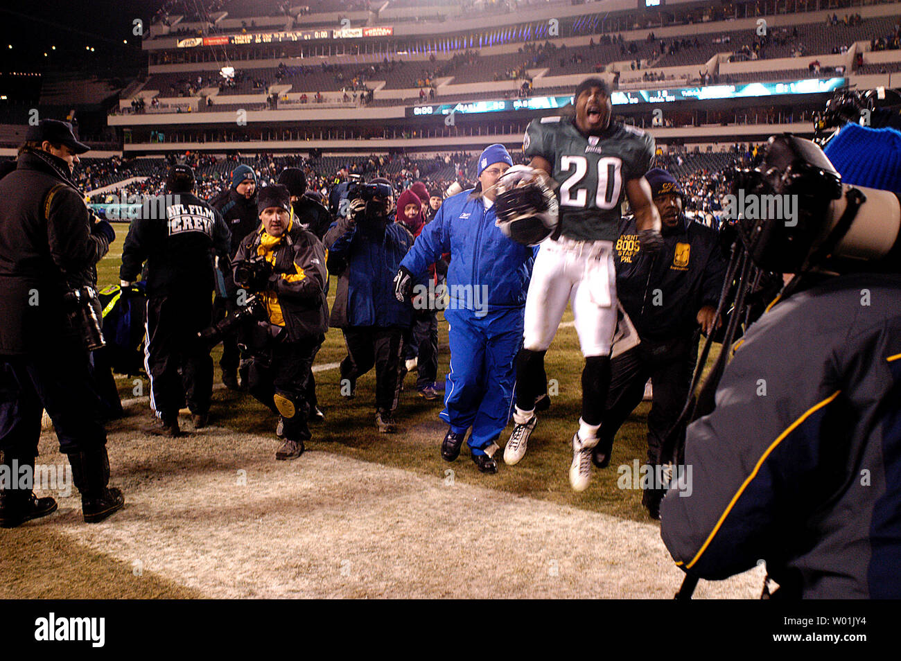 A jubilant Eagle Brian Dawkins (20) makes his way off the field following the Eagles 20 to 17 overtime victory over the Packersas Philadelphia hosts Green Bay in a divisional playoff game at the Lincoln Financial Field in Philadelphia, on January 11, 2004. (UPI Photo/Jon Adams) Stock Photo