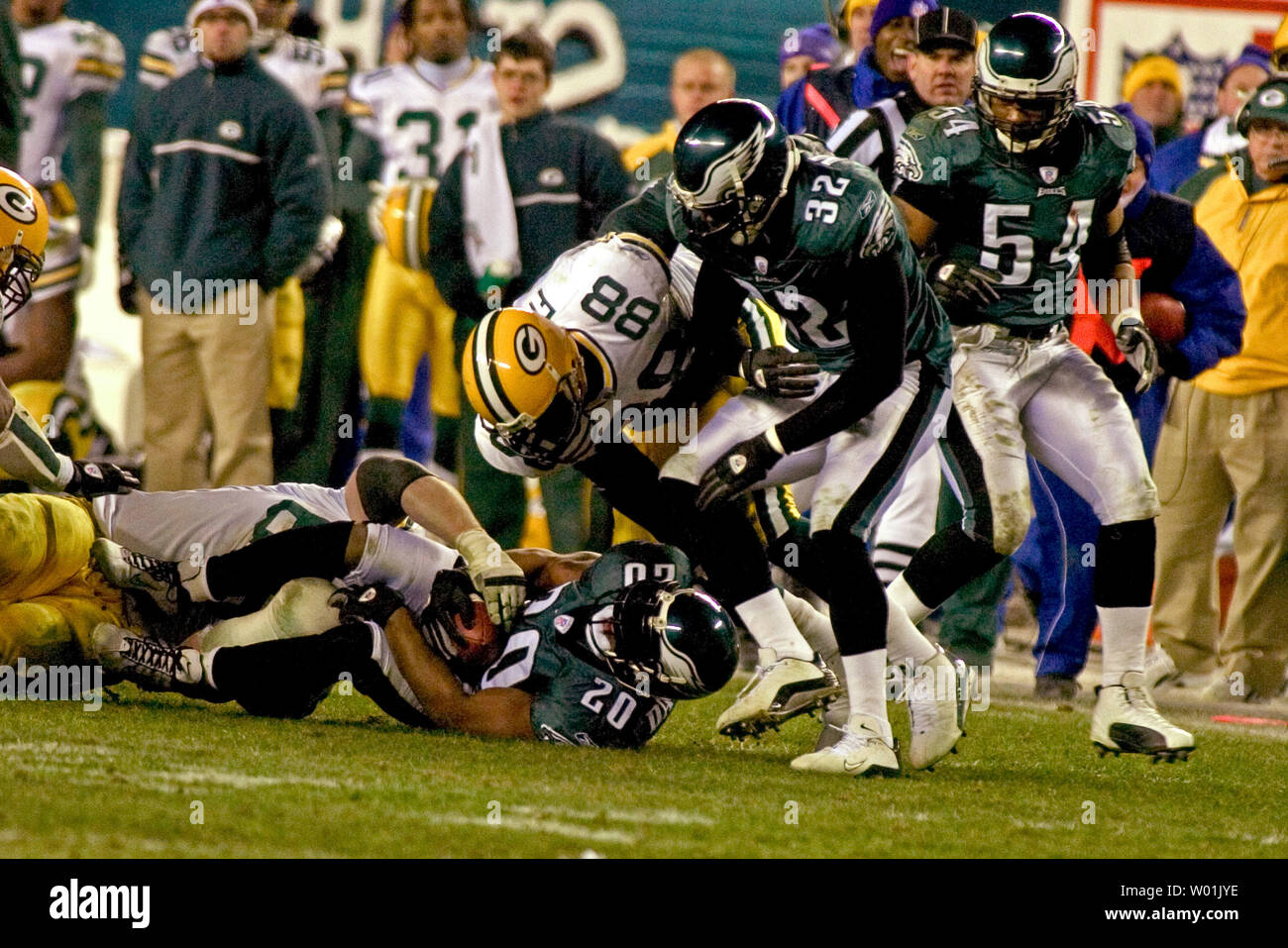 The Eagles' Brian Dawkins (20) picks off a Brett Favre pass in overtime setting up the Eagles 20 to 17 victory as Philadelphia hosts Green Bay in a divisional playoff game at the Lincoln Financial Field in Philadelphia, on January 11, 2004.  (UPI Photo/Jon Adams) Stock Photo