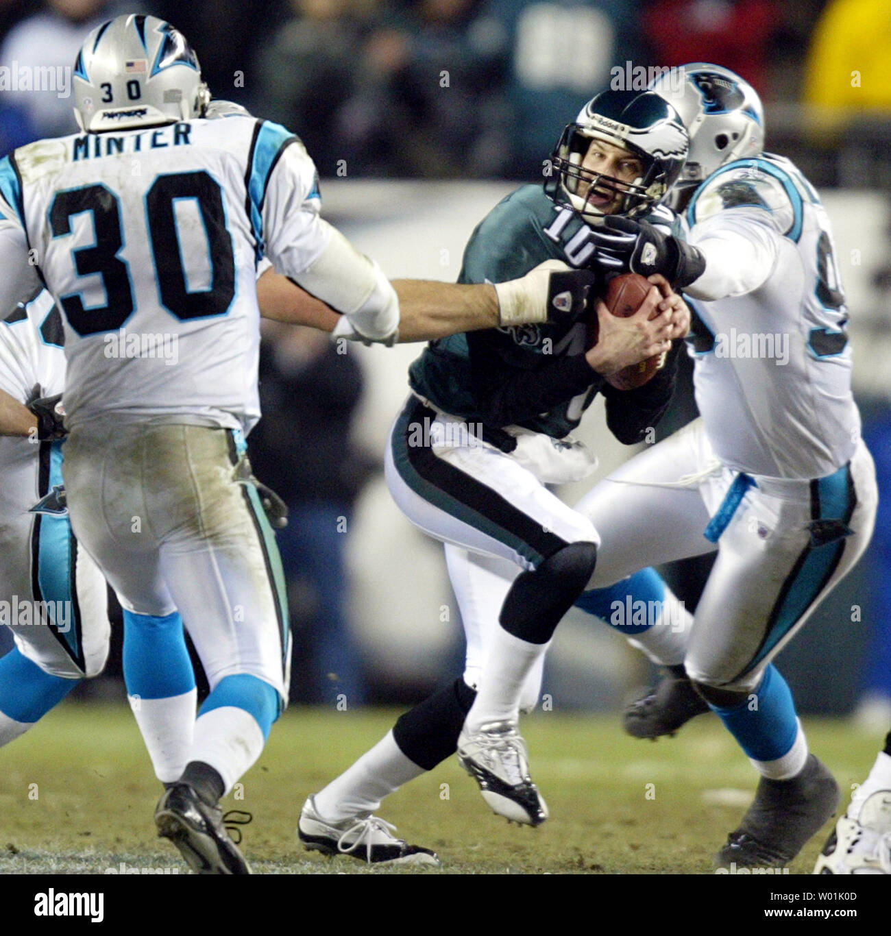 Carolina Panthers defender Micheal Rucker grabs the face mask of Philadelphia Eagles quarterback Koy Detmer. The Carolina Panthers defeated the Philadelphia Eagles 14-3 at  Lincoln Financial Park in Philadelphia, PA  on January 18, 2004.    (UPI Photo/John Angelillo) Stock Photo