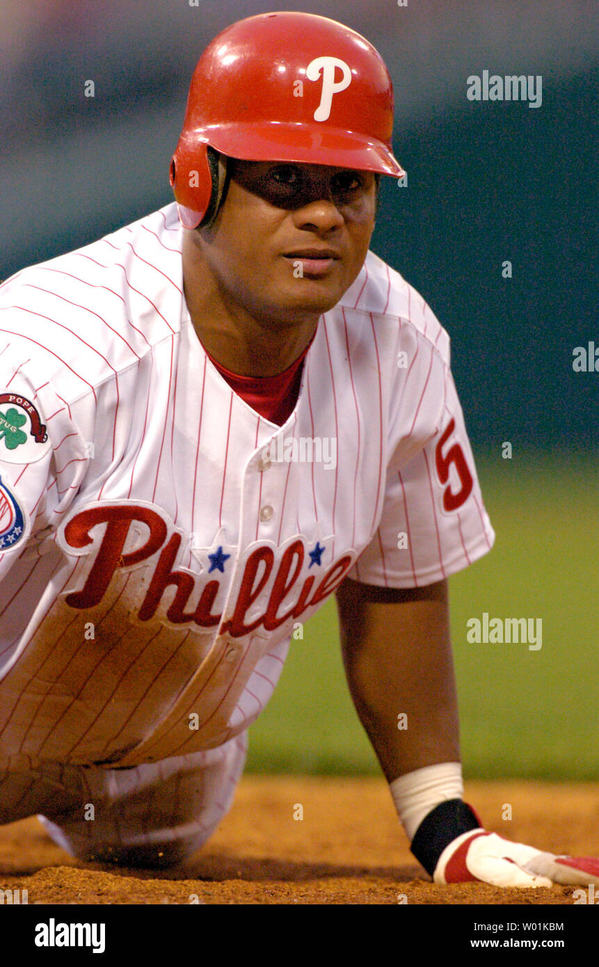 The Phillies' Bobby Abreu (53) is held to first base by a Sunny