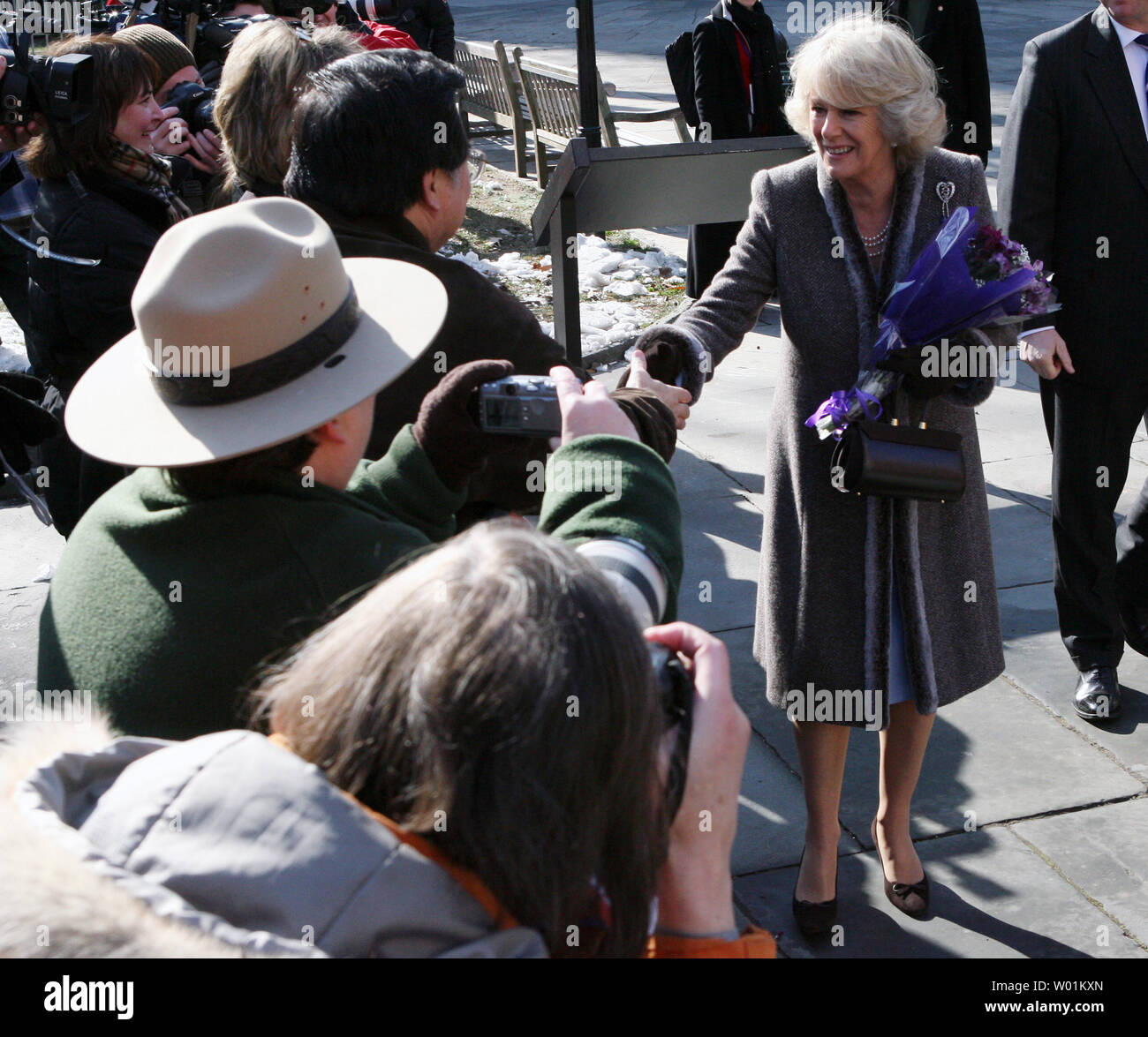 camilla-parker-bowles-the-duchess-of-cornwall-greets-the-crowd-after-receiving-a-bouquet-of-flowers-upon-her-arrival-at-independence-hall-in-philadelphia-on-january-27-2007-she-and-prince-charles-are-on-a-2-day-visit-to-philadelphia-and-new-york-upi-photojohn-anderson-W01KXN.jpg