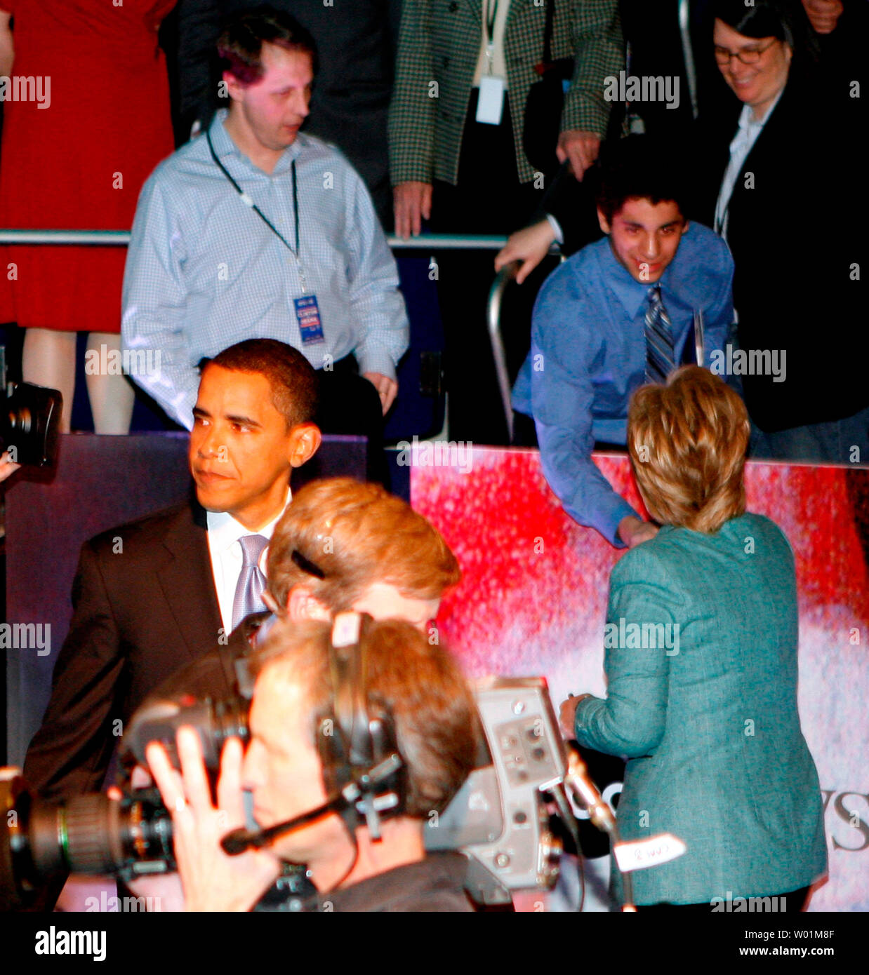 Barak Obama turns away from Hillary Clinton as the two mingle with the crowd following their debate at the Kimmel Theater at the  National Constitution Center in Philadelphia on April 16, 2008. Clinton spent a long time meeting with members of the crowd, but Obama left the hall almost immediately after the debate.     (UPI Photo/John Anderson) Stock Photo